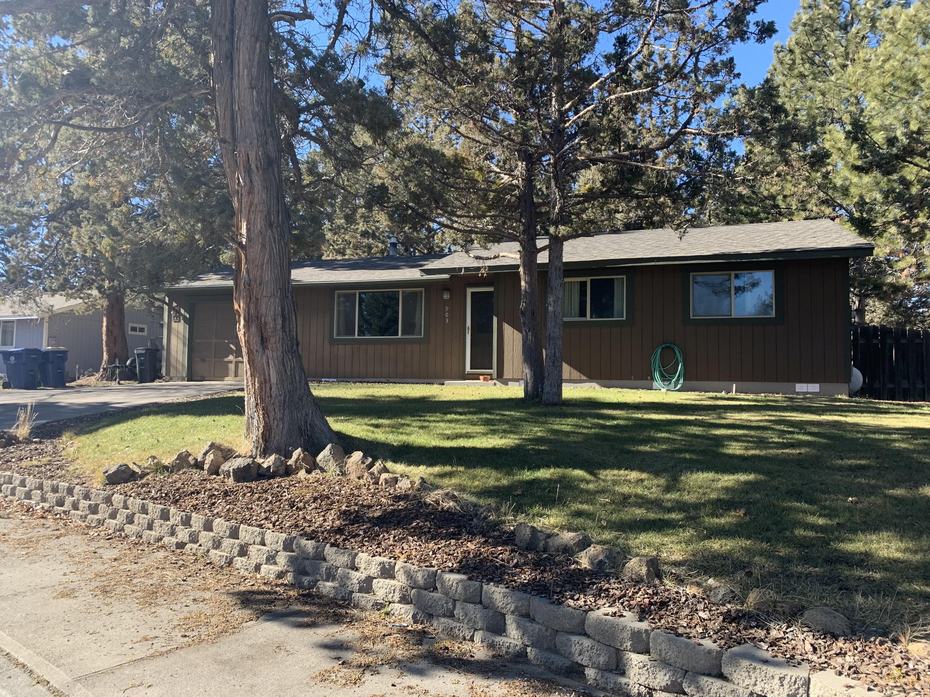 This single level rancher is the definition of CUTE on a quiet cul-de sac right across from Kiwanis Park in a close-in SE Bend location on a HUGE RM zoned lot. The fenced yard provides an amazing opportunity for your own private oasis with large gear shed and underground sprinklers in front and back yard. The kitchen and bath have granite counters, new interior paint, newer propane stove, and newer roof. Hardwood floors throughout- there is no carpet in this home! One car garage is attached. Make this adorable home yours by calling your favorite Realtor today.