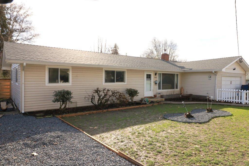 Bright and Clean! Featuring 3 bedrooms and 2 baths with beautiful original hardwood floors throughout the living room, hallway and two of the bedrooms. Comfortable floor plan with the dining room and kitchen circling back to the living room. Laundry room is off the dining area along with a second bath. A new fireplace insert keeps the whole house toasty warm! Recent updates include a newer roof, carpet less than 4 years old, and newer fencing. Summer living will be out in the large back yard! Covered patio, raised garden beds, wood shed with large enclosed garden tool closet and lawn to play and relax in. All of this on .20 acre. Close to shopping and town with city services and schools.