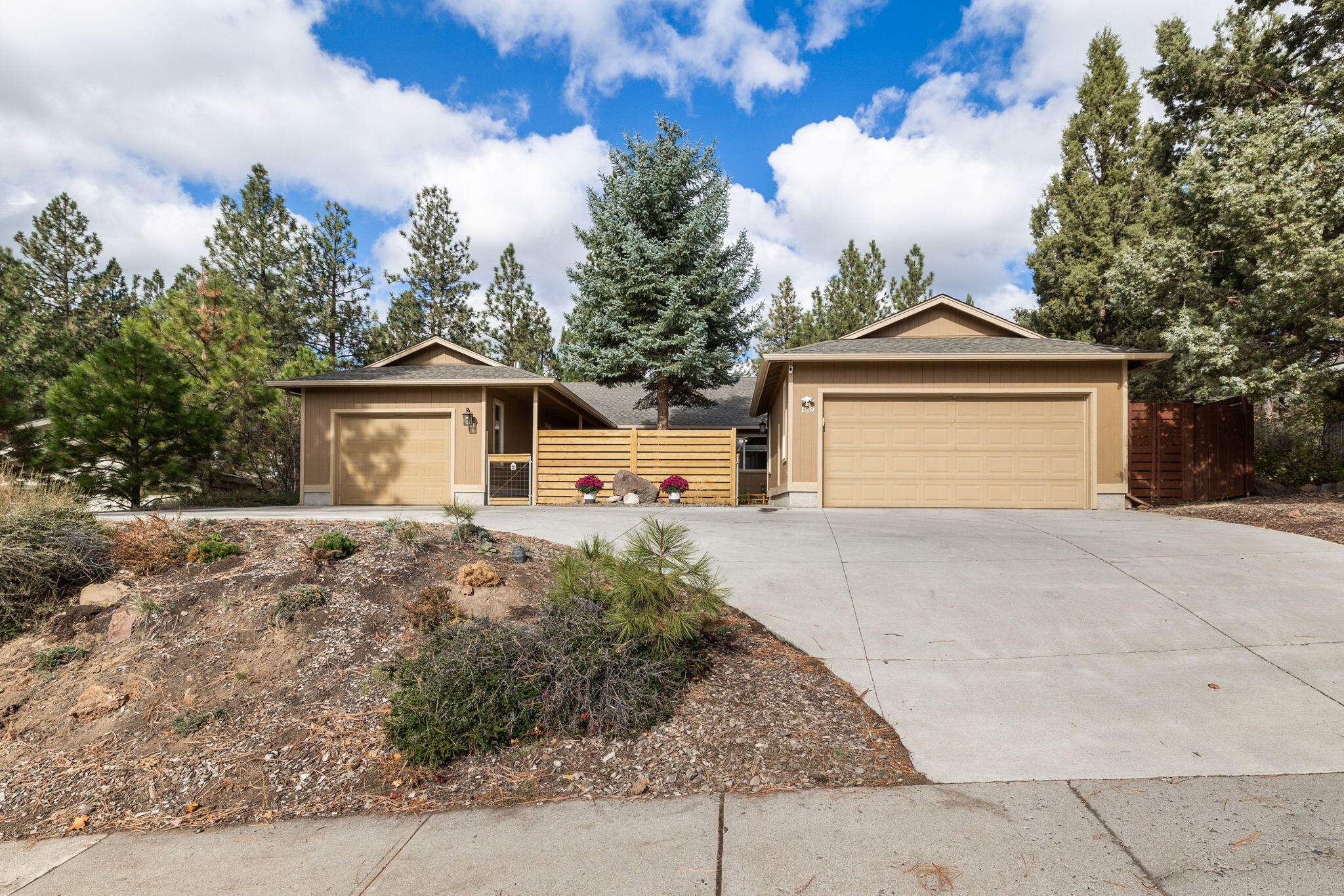 A hard to find SINGLE LEVEL DUPLEX in a great Westside location! ''Owner will carry.'' Close to OHSU, downtown, the Old Mill, Deschutes River, hiking and biking trails, restaurants, music venues, shopping and only 20 minutes to Mt. Bachelor! These well maintained, spacious units feature laminate wood floors, gas fireplaces and offer a nice separation between the two. Enter through a gated courtyard into an updated Unit 139, complete with stainless steel appliances, new kitchen cabinetry, gas range & barn door to primary bath. The patio & landscaped fenced side yard offers a serene place to enjoy the rock outcroppings and treed lot. This unit has a 2 car garage with a sink. Unit 141 has a gated front yard, newly installed bay window in the dining area and a wrap around wood deck, with a large fenced backyard, single car garage. Both units are in very good condition. Situated on  a large lot and on a nice and quiet cul-de-sac.