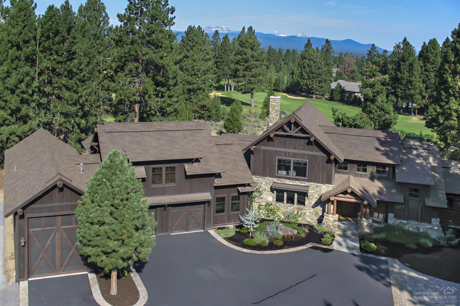 Stunning high end lodge style home sits on 1.78 acre lot looking onto Lost Tracks Golf Course and the Cascade Mountains in desirable Sunset View Estates gated community! Featuring 3 master suites, office with custom built ins, expansive gourmet kitchen with Viking appliances, bonus area with incredible views plus 1835 SF garage with 56' RV bay. Amazing detail in this home; breakfast bar imported from South Africa, artisan crafted juniper & iron railing, two way Dove Mtn. rock fireplace and the list goes on!