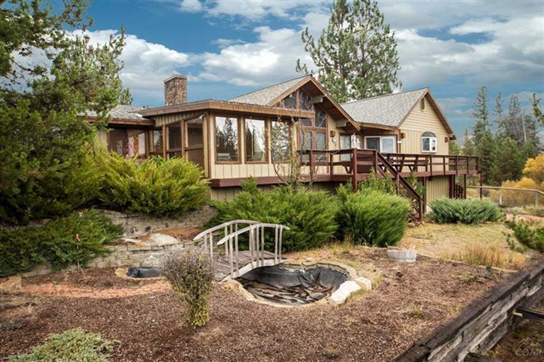 Remodeled 3535 SF home w/4bed + office. Master bath w/lg jetted tub & new tile shower. Media room, family room, huge kitchen w/handcrafted cabinets, granite counters, walk-in pantry & sunroom w/hot tub. Home has cedar eves w/copper accents. Exterior siding on home, garages & storage bldg have just been painted. Watch the wildlife from the wrap-around deck or go to your pvt access to +/- 300 ft of Little Deschutes RIver frontage for fishing, swimming or floating. A comfortable home for full time or vacation.