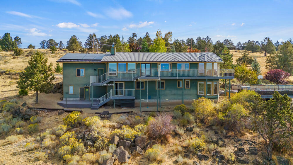 Stunning 180° views of Klamath Lake and Mt. Shasta This home has nearly 2 acres and sits right on the Pacific Flyway for enjoying soaring bald eagles and other unique migratory birds right from your deck. This home features family and living rooms, formal and informal dining, an office, theater (could be 5th bedroom), mud room, and a large, partially finished work room with a/c and 220, plus an electric vehicle charging station. Exterior amenities include solar panels, basketball court, an 80-yard archery range, RV and boat parking, plus fruit trees and a gardening area. Enjoy the incredible sunsets in the peacefulness of this serene location. You can even choose your own paint colors with the generous $15,000 paint allowance!