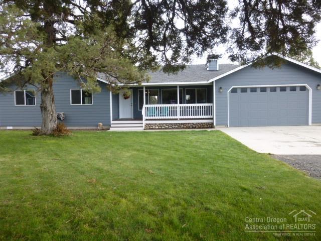 This amazing rural property is located in a great neighborhood of nice homes on paved road. Open floor plan with lots of windows and light. 3 large bedrooms AND den (or bonus room/4th bedroom). Gourmet kitchen with granite counter tops, huge island & tile floors. Bathrooms have custom tile throughout. Beautiful landscaping including front & back lawns. Trees galore! Circular driveway with stone entrance pillars. New fence in back yard. New exterior and interior paint. Very well maintained home. Must see!