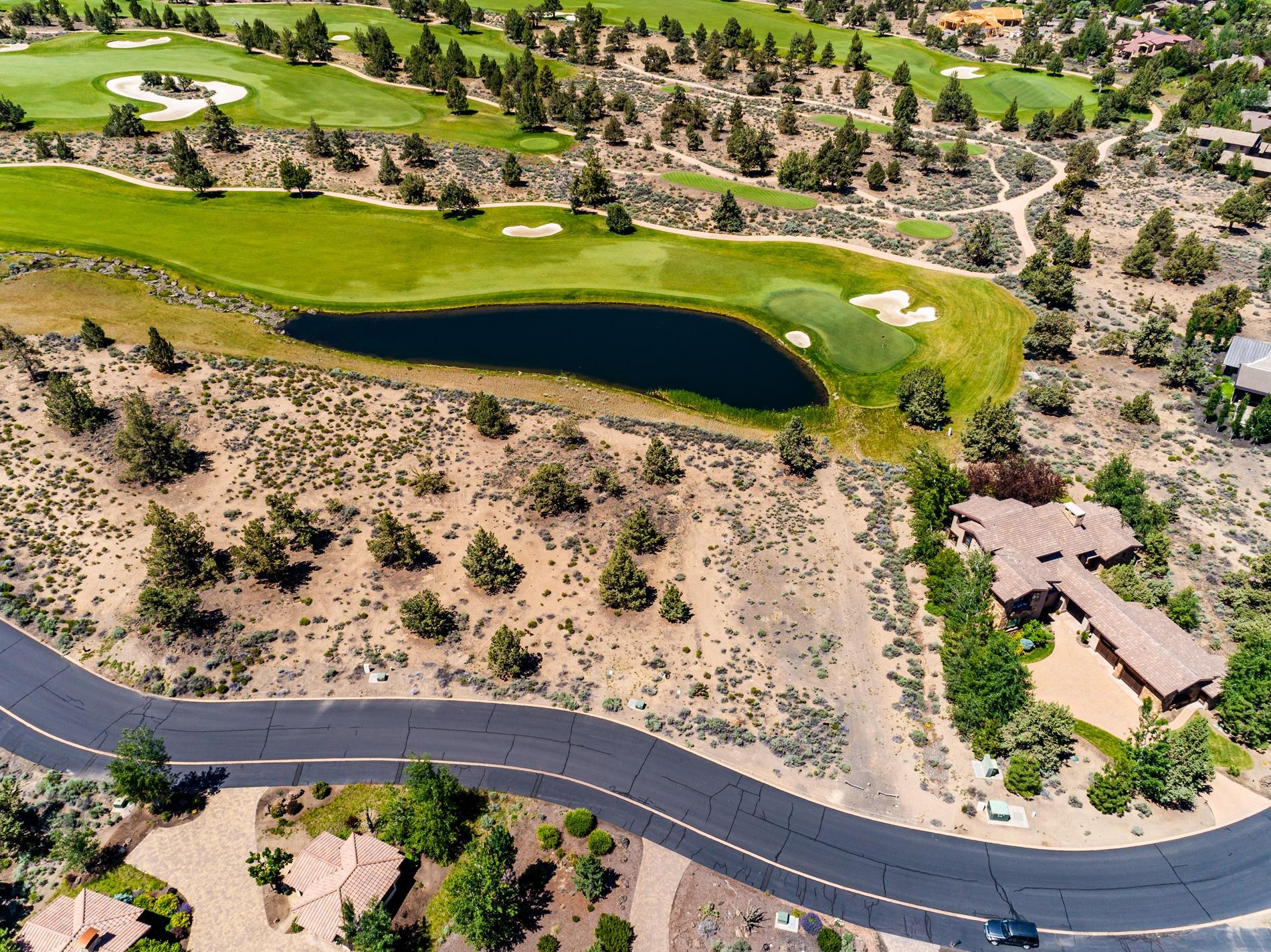Take in amazing cascade mountain, golf and lake views from this .49 acre homesite located off the 8th green of the Jack Nicklaus Signature Course at Pronghorn Resort. Peacefully located in the Estates at Pronghorn, this flat, buildable lot is is perfect for anyone looking to enjoy serene waterfront views of the greenside lake and big Cascade Mountain views beyond the golf course.
Named by golf magazine one of the 25 best golf resort communities in the US, enjoy easy access and close proximity to the grand 55,000-square-foot clubhouse at this beautiful high desert oasis. With 2 world class golf courses,  & all the amenities of Pronghorn resort, including 3 swimming pools, tennis court, spa, numerous dining outlets, & the Huntington Lodge - a 104 room boutique hotel. 
Price includes transfer of full $115,000 required Pronghorn Membership deposit to Buyer.
Seller Carry Financing Available.