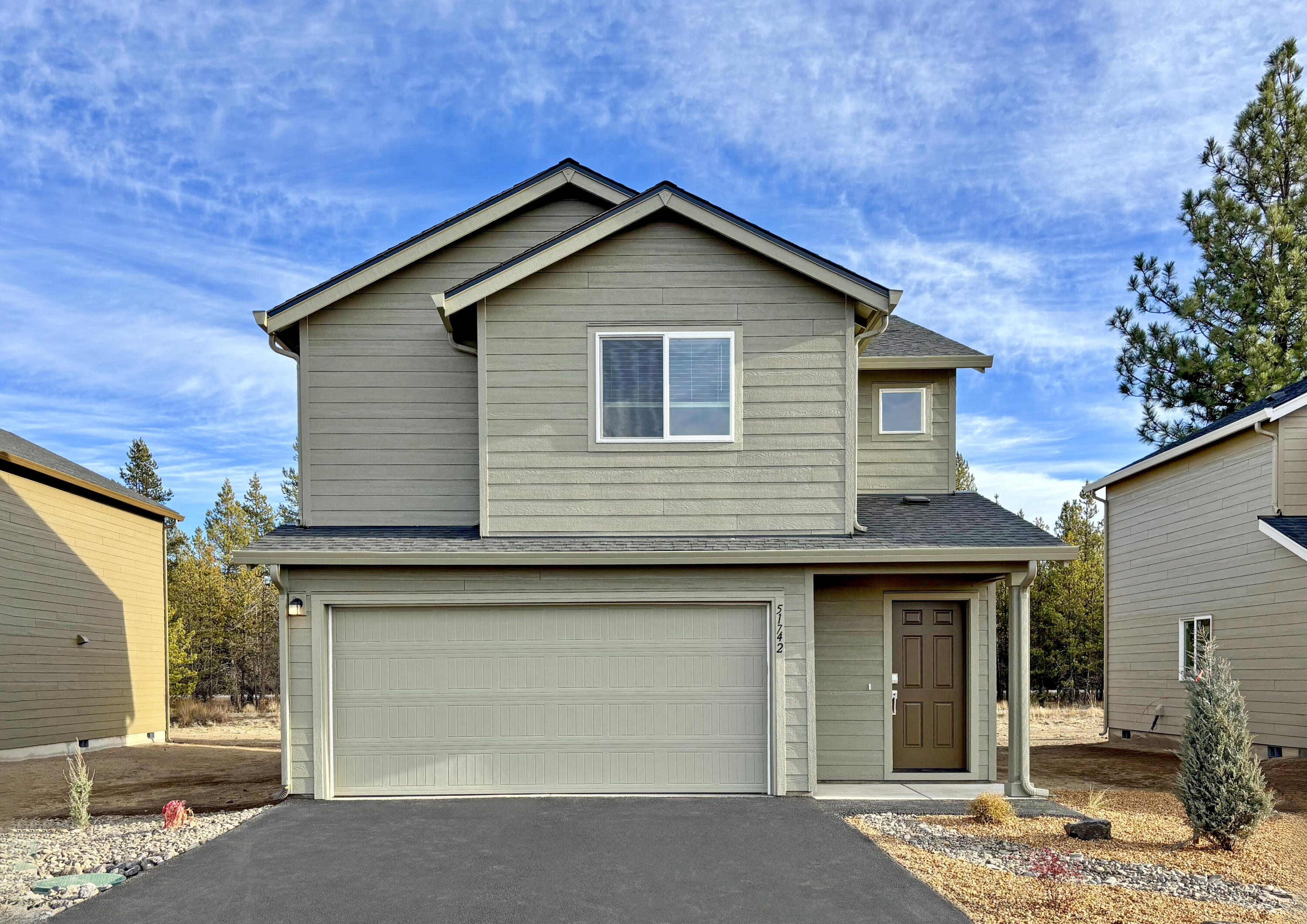 This new construction home is located at Reserve in the Pines and is Move-In-Ready! The Irving plan features two stories of living space, starting with an open living and dining area on the main level that connects to an outdoor patio through sliding glass doors. Upstairs, you'll find three bedrooms, including a primary suite with a spacious walk-in closet and spa-like bath with a double vanity. Interior highlights include quartz countertops, shaker-style cabinetry, and LVP flooring in the kitchen and bathrooms. This home also includes central AC, a refrigerator, washer and dryer, a xeriscaped front yard with a drip irrigation system, and blinds—all at no extra cost! Homesite #93.  Photos are of a similar home, features and finishes will vary. *Below-market rate incentives available when financing with preferred lender.*
