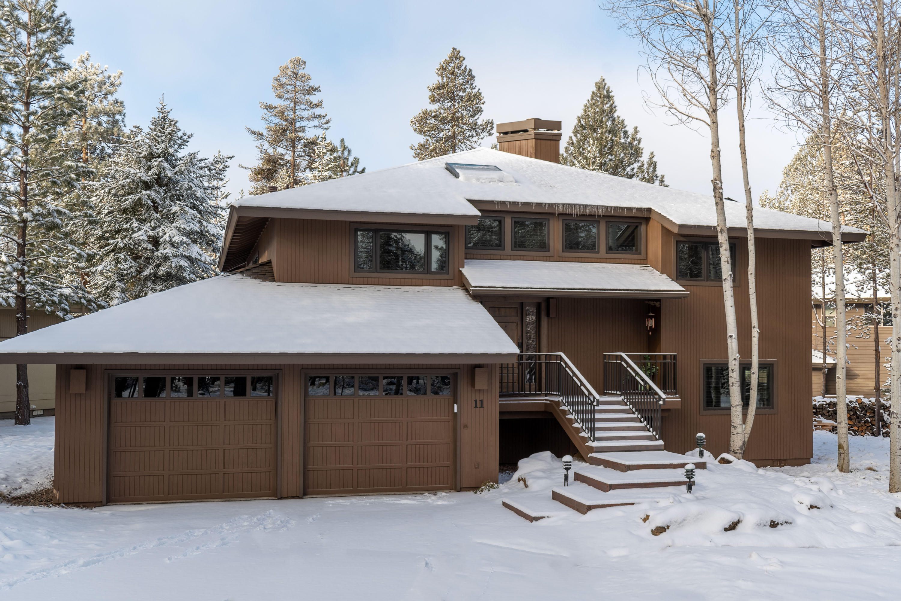 Truly exquisite 2019 full-home remodel with amazing high-end NW finishes throughout! Enjoy the reverse living tree house feel in the vaulted great room w/ gas start wood burning FP, & huge wall of windows offering golf course views! Kitchen features granite counters, stainless appliances, eating bar & tons of cabinetry w/ soft-close hardware. Covered upper deck expands the great room area to take the party outside! Lovely master bedroom suite offers private access to the upper deck plus a lovely bath with double quartz vanity, jetted soaking tub, walk-in rain shower & large walk-in closet. A powder bath completes the upstairs. Downstairs is a laundry room/powder bath, 3 guest bedrooms & a second full bath w/ double vanity & tub/shower combo. Lower covered spacious deck space is wired for a hot tub. 50-year comp roof installed 2018. High-end wood clad windows, sliders, skylight, furnace, A/C & HWH, decking, custom railing included in 2019 remodel. 2-Car finished garage. Ext Paint 2020.