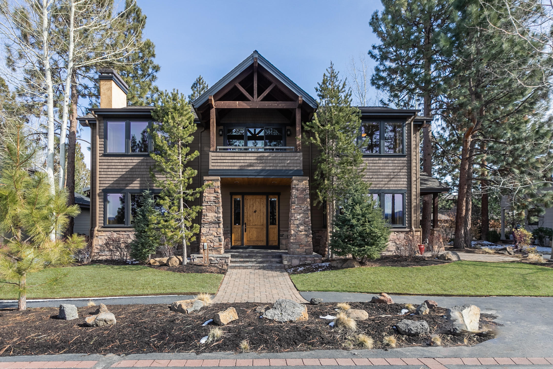 This stunning Schumaker Built Home, Nestled within beautiful mature pine and aspen trees, is an ideal location. Direct trail access is out the front door to Shevlin Park, Phil's Trail System, Tree Farm and points beyond. Exposed beams and Hickory hardwood floors greet you as you enter into this warm and inviting home. Beautiful kitchen, with upgraded gas range, dishwasher, 55 appliances, including double ovens and concrete countertops. The flow of the rooms on main floor allow for easy entertaining from kitchen to dining to living room, yet allow for private space when desired. Generous pop outs in living and dining spaces and upstairs bedrooms provide plenty of ambient lights and views. Decks in front and back on second floor and three paver patio spaces to enjoy outdoor living. 3 car garage with built in shelving for extra storage. Award winning schools and downtown conveniences. Western Exposure allows for spectacular Cascade Mountain Views and amazing sunsets.