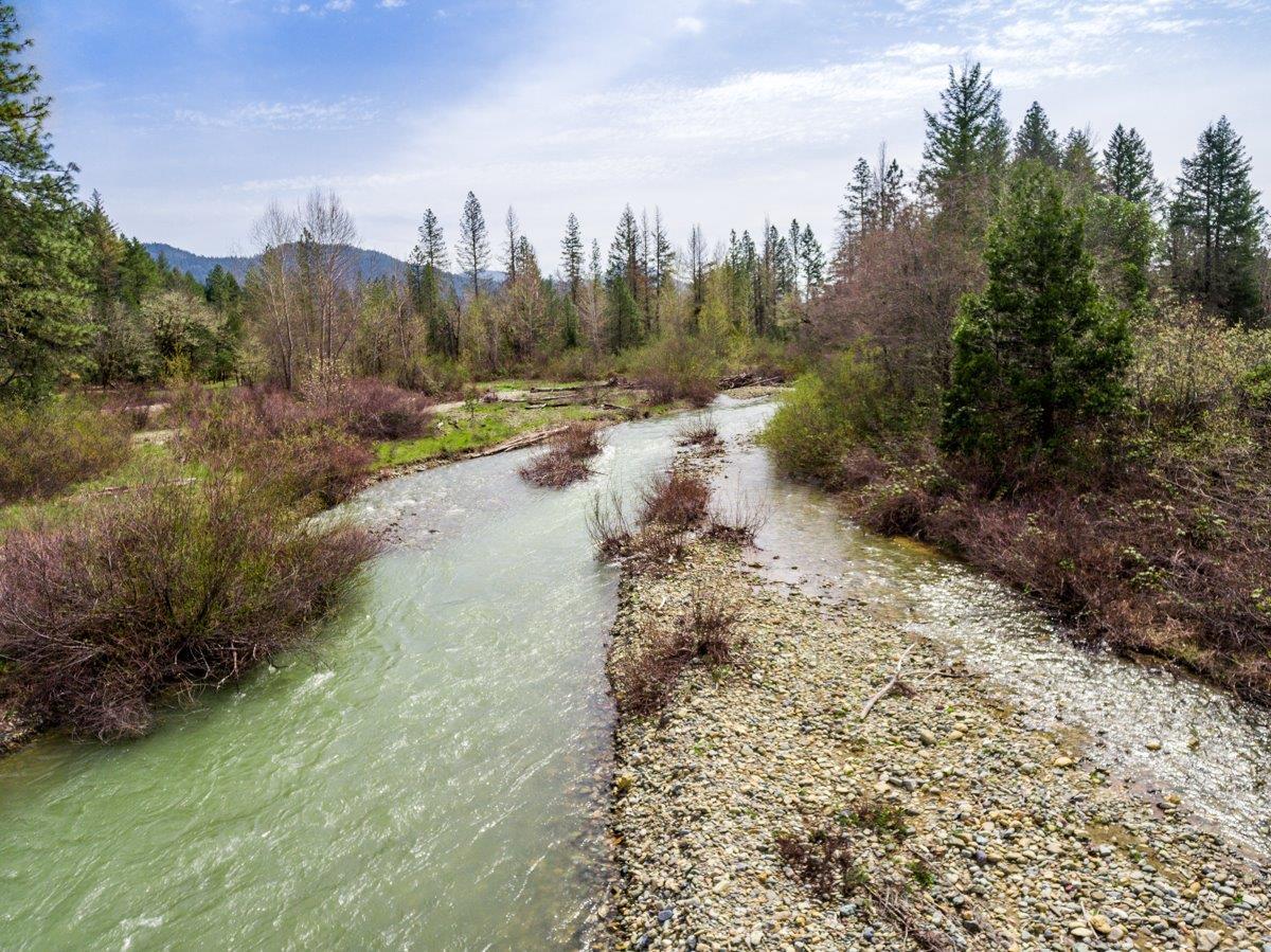 Beautiful Althouse Creek frontage along the east property boundary. BLM adjoins another portion. This 42.88 acres is located at the end of a private road behind a locked gate and is completely fenced! 12 acres of water rights. There are 2 professional greenhouses (30x96), full sun, amazing views of surrounding mountains. There is an installed septic system and an additional septic approval so you can choose your homesite location. There are 35 young fruit trees in a deer fenced area near the creek. Irrigation has been piped thru-out this property. There is also an existing shop. Oh, and the well log indicates 50gpm plus. Perfect setting for your dream home. Power is present to greenhouses and shop.