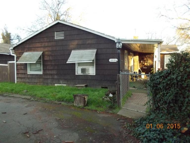 WOW!! This is a beautiful piece of ground (2.2 acres), in quiet, rural Southwest Medford. End of the lane privacy perfect for building your new home. Home needs work or removed. Outbuildings and barn are already there so you can put a horse or two out there. Medford IRRIGATION!!! City water and sewer!! You can't beat this opportunity to live close into town and yet be in the country.