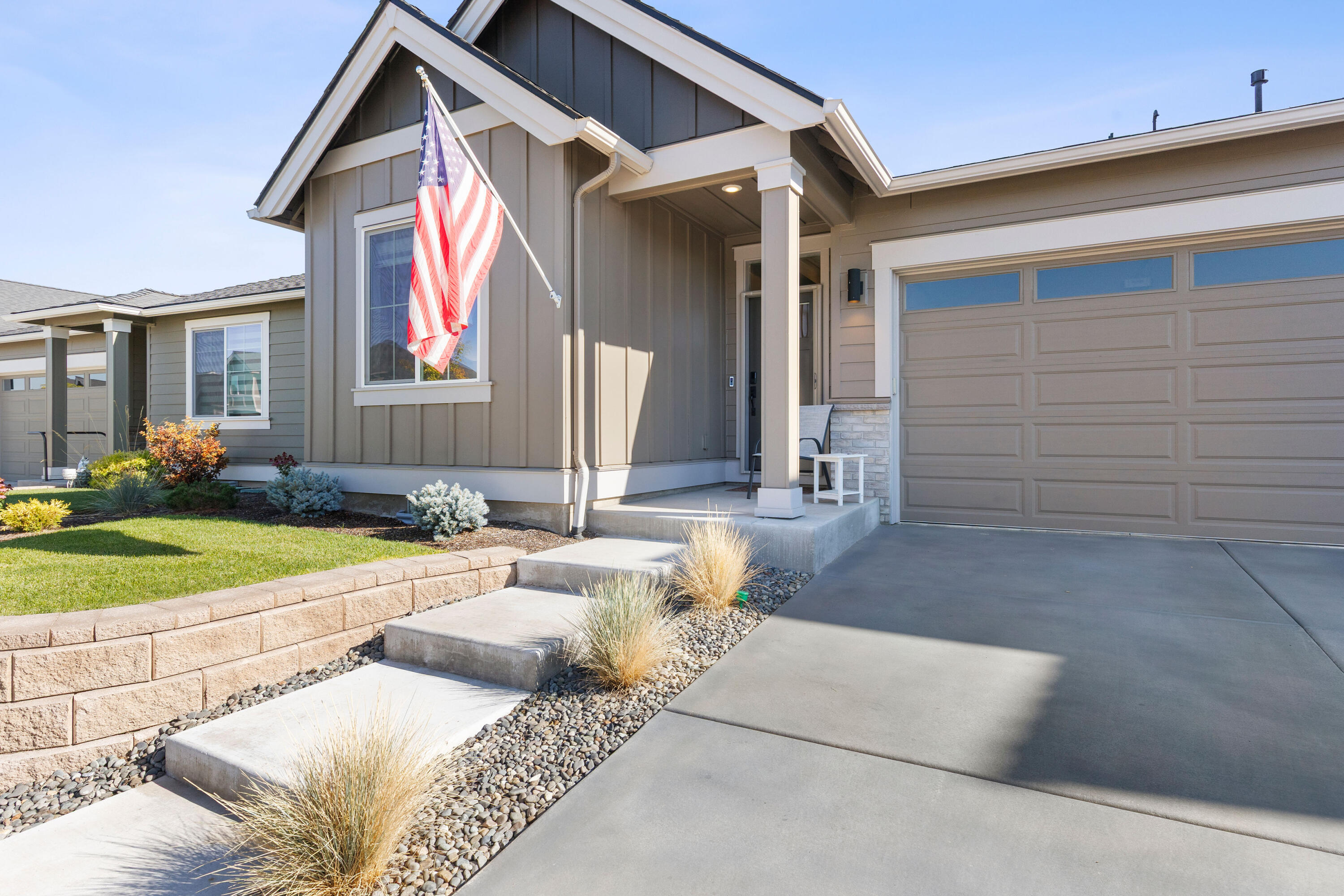 Step into style in this nearly new, single level home featuring an open layout. This served as a second home and is hardly lived in!  The vaulted great room welcomes you with a cozy gas fireplace and extra-tall sliding doors that flood the space with natural light and lead to a spacious covered patio, near the fountain - also accessible from the serene primary suite. Interior highlights include wood composite plank flooring from entry though great room, full height kitchen backsplash for a modern touch, a tile shower in the primary suite for spa-like relaxation, separated front bedroom with ensuite access to a full bath, and Central A/C for year round comfort. Outdoor and community features include the landscaped rear yard, covered patio for entertaining, access to Barnes Butte public walking trails, common areas, swimming pool, and picnic pavillion.
