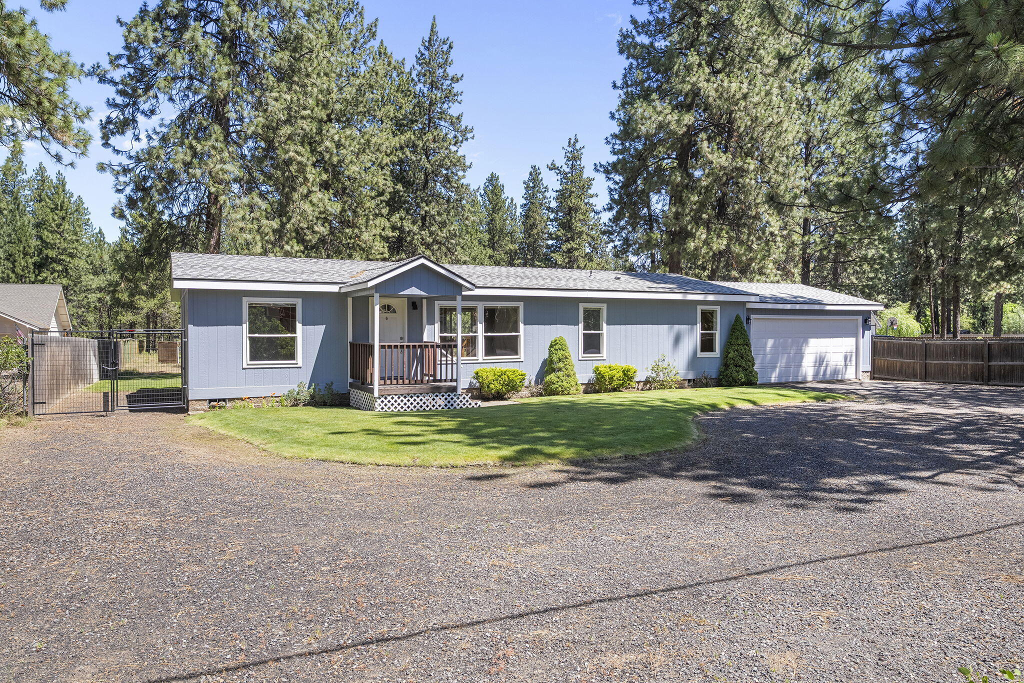Welcome to this beautifully maintained 3-bedroom, 2-bath manufactured home nestled on a spacious 0.89-acre lot in the desirable Deschutes River Woods neighborhood of Bend. Offering over 1,500 square feet of comfortable living space, this home features simulated wood flooring, a walk-in closet in the primary suite, and all appliances included—making it truly move-in ready.

Step outside to enjoy a large paver courtyard, expansive lawn, and a serene natural area perfect for relaxing or entertaining. The attached two-car garage provides ample storage and convenience. Located just minutes from all the amenities of Bend, yet offering the space and privacy of a large lot, this property blends the best of both worlds.

Don't miss this opportunity for peaceful living with room to breathe!