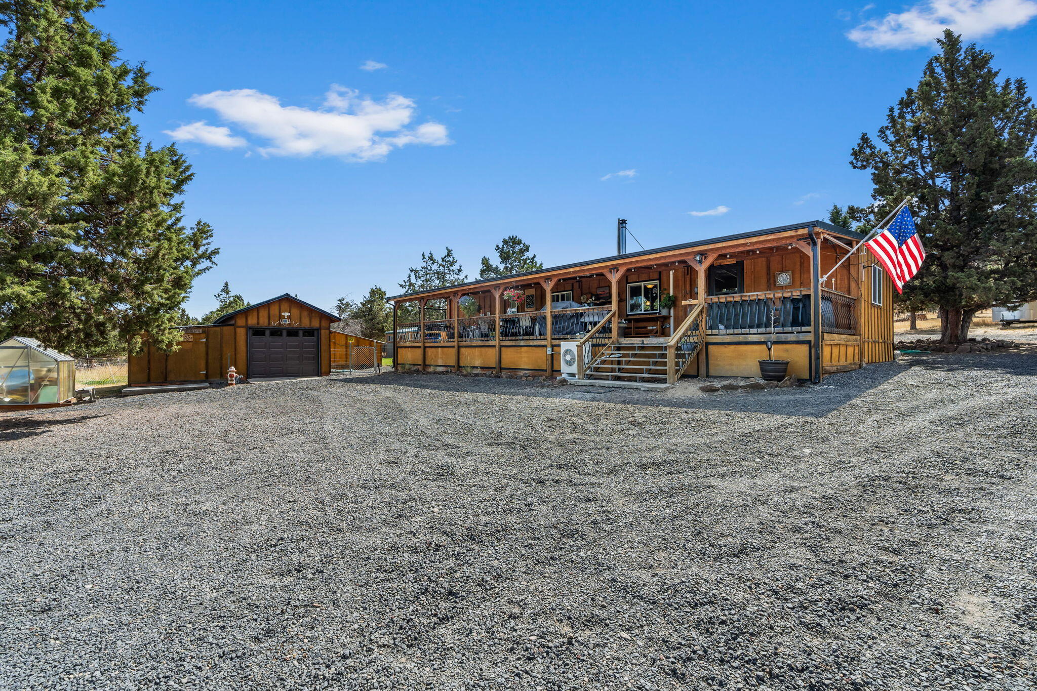 Welcome home to this lovingly updated 2 bedroom, 1.5 bath house on 2.26 acres just a few minutes from town. Property is completely fenced and gated with pull thru driveway. Newly added 24x36 2-sided carport/shop for RV parking, as well as a detached garage with workshop addition on one side. There is a nice garden with fruit trees, greenhouse, fenced pasture for animals & multiple storage sheds. Concrete pad was poured for pool area or basketball court. Beautiful views of Mt. Jefferson & Ochoco Mountain range. Home was updated with board and batten siding, metal roof, ductless heating and A/C, Blaze King woodstove, new flooring remodeled bathroom & kitchen with Corian counters, undercount sink, lots of cupboards with slide outs, and updated appliances included in the sale. There is also a family room addition that could easily be converted to a 3rd bedroom, it even has a 3/4 bath attached. Front of house has covered deck the entire length of house perfect for eating & entertainment.