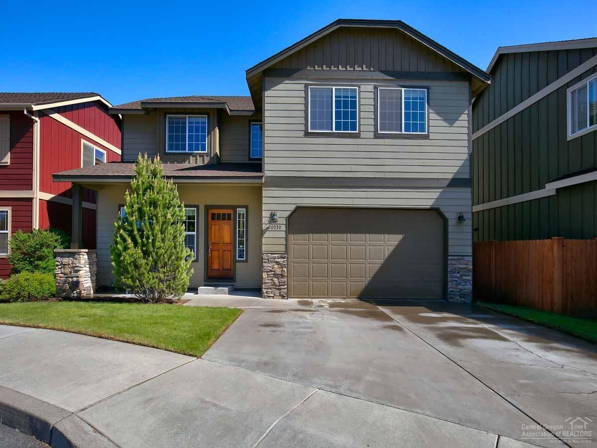 This ideal home is just minutes from schools, shopping and everything that makes Bend special. A gas fireplace, new tile and acacia hardwood flooring, and new quartz kitchen counter tops make this home move-in ready. The oversized upstairs bedrooms are light and bright. The private fenced back yard is perfect for dogs, kids and entertaining, and there is a pad for the hot tub of your dreams. The cul-de-sac location allows the kiddos to safely ride bikes. Silver Rail school is within walking distance.