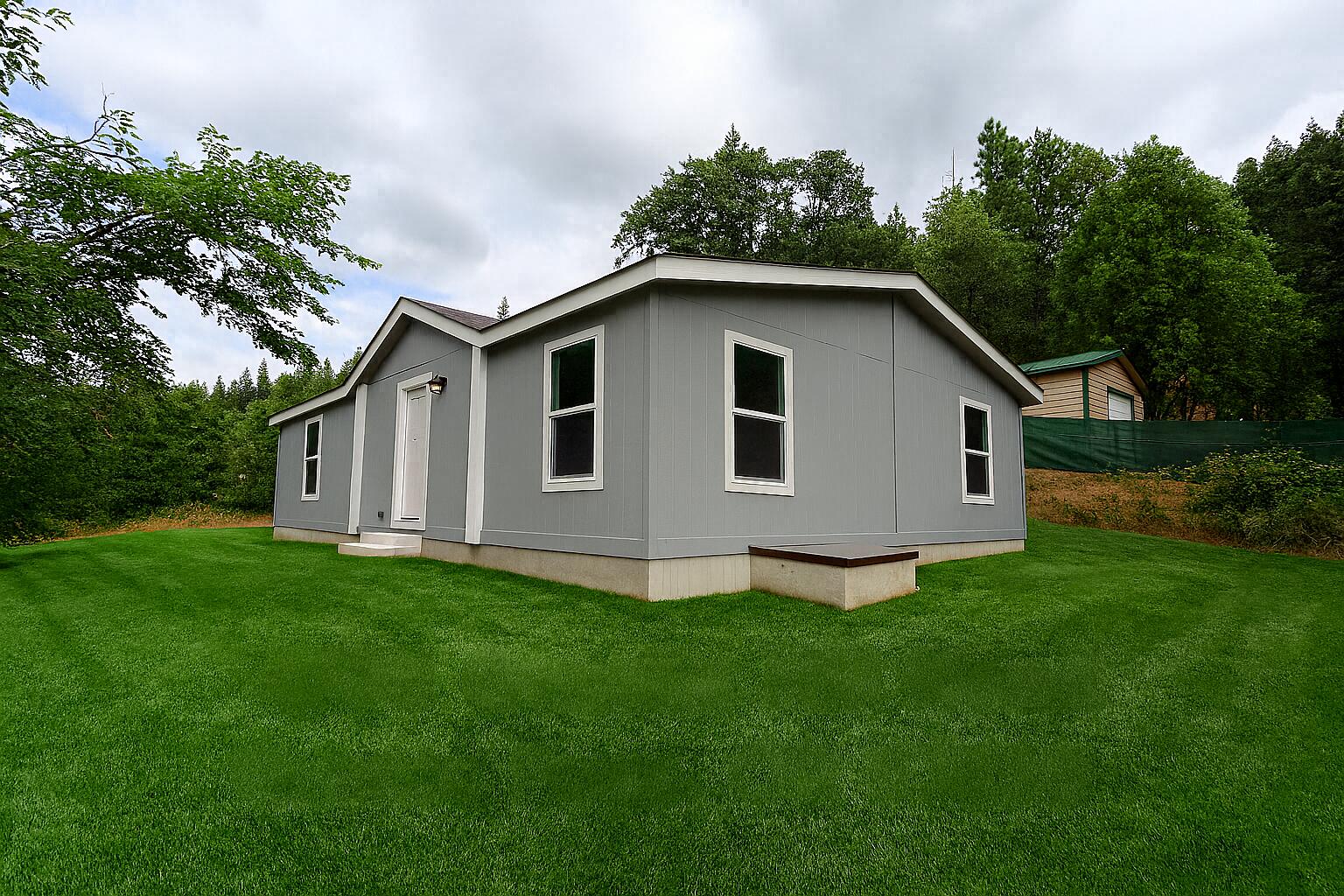 Welcome to this brand-new 2024 manufactured home offering 3 bedrooms, 2 bathrooms, and 1,296 sq. ft. of stylish living space. Inside, you'll find an open floor plan with a bright living area, modern kitchen, and a comfortable primary suite with private bath.

Outside, the property includes a spacious shop, perfect for storage, hobbies, or workspace needs. Backing up to both county and BLM land, this home offers added privacy and direct access to the outdoors—ideal for those who love hiking, exploring, or simply enjoying the peace of nature.

All this while being conveniently located just minutes from town, making it a perfect balance of comfort, functionality, and lifestyle. Don't miss your chance to own this beautiful new home with shop in a sought-after Grants Pass location!