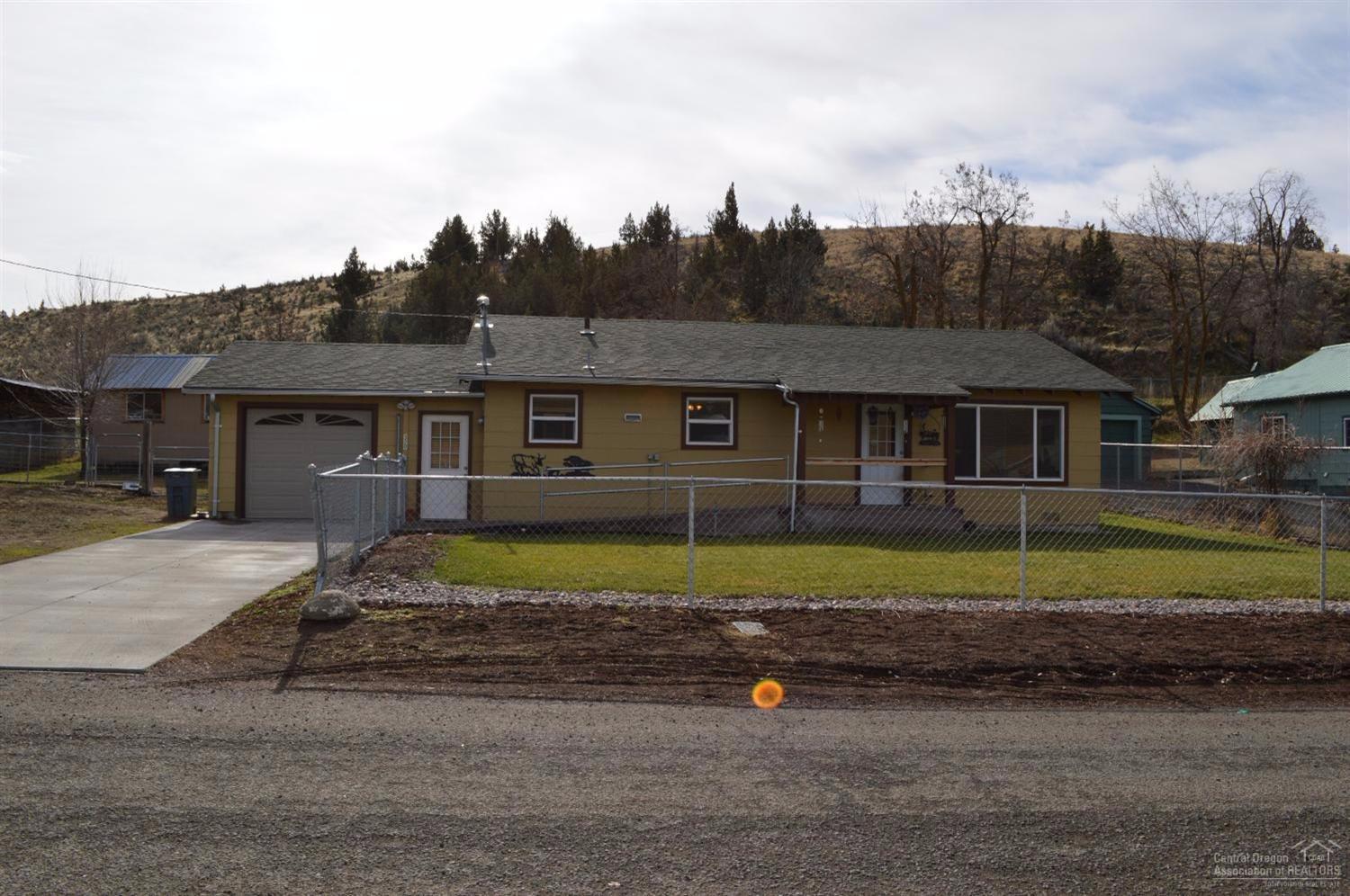 Cozy home in the sleepy little town of Mitchell, Oregon! This open concept 2 bedroom 1 bathroom home has been updated with tile and laminate flooring, tile counter tops and stainless steel appliances. Covered back porch and handicap accessible. 2 storage sheds, fenced, and nicely landscaped. Located on nearly 1/3 acre, this property has plenty of room for your RV and more!