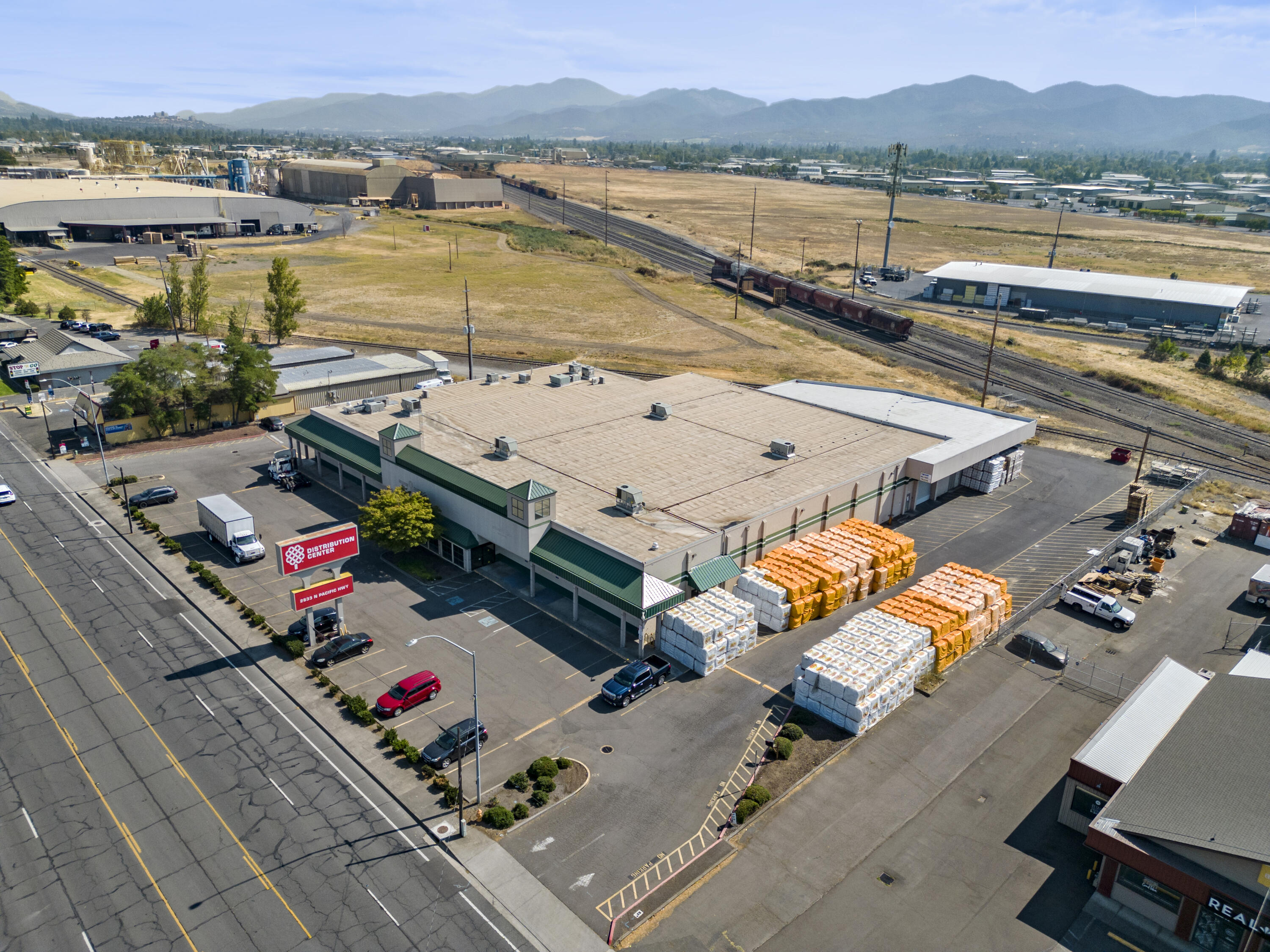 Former Grange Co-op distribution / corporate office building in Medford, OR. This building has a flexible zoning (Heavy Commercial) which allows for a large spectrum of uses. It contains roughly 7,000 sf. of 2 story office space, break and conference rooms, and large open areas previously used for warehousing / distribution and retail activities. The building is sprinkled, nearly all climate controlled, has high ceilings, is fed by a large electrical infrastructure, and is well located. It also has a loading dock, and a paved onsite parking lot. This building should be vacant and ready for buyer occupancy by November 1, 2023.

Notice:  No warranty or representation, express or implied, is made as to the accuracy of the information contained herein; all information contained herein is subject to change, and errors, and is subject to independent verification.  

Please see Private Remarks.  Property to be sold with deed restriction prohibiting competing uses to Grange Co-op.