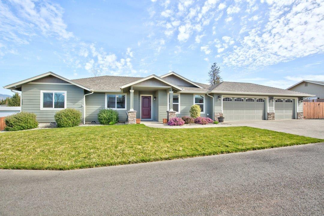 Beautiful home built by Kirk Chapman in 2014 located in desirable Harvest Meadows Estates in Southwest Grants Pass! Featuring an open 1,738sqft floor plan with 3 bedrooms 2 bathrooms, additional room for office/den, finished attached three car garage w/ storage above, 220 outlet & room for RV Parking. Including beautiful laminate flooring throughout, spacious living room with vaulted ceilings and gas fireplace, kitchen with island, granite countertops, custom hickory cabinets, gas cooktop, dining area with access to covered back patio great for entertaining w/ natural gas stub for bbq, master bedroom with ensuite bath, walk-in closet, large laundry room with sink & ample storage. Set at the end of a low traffic road and backing up to a larger lot creating a peaceful setting with beautiful views. Minutes to town, shopping, restaurants, schools, medical & more. Schedule your tour today!