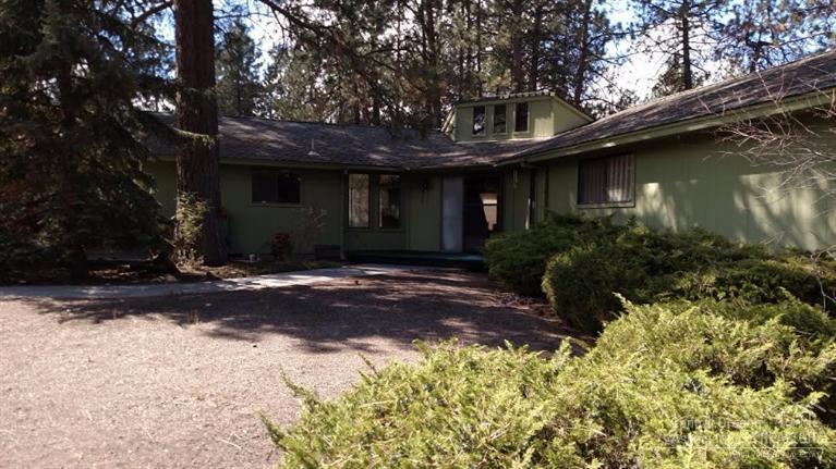 1.07 Acres! Hard to find only 3 minutes to Fred Meyer. Room for shop and toys. Dignified 1976 Vintage, Luxury built, 2296 sq ft ranch with open beam wood ceilings, Huge indigenous lava fireplace, Large spa style bathroom, built-in, oodles of storage. Long drive way makes this property private, Large flat open back yard, House to be purchased as is. Vacant and easy to show.