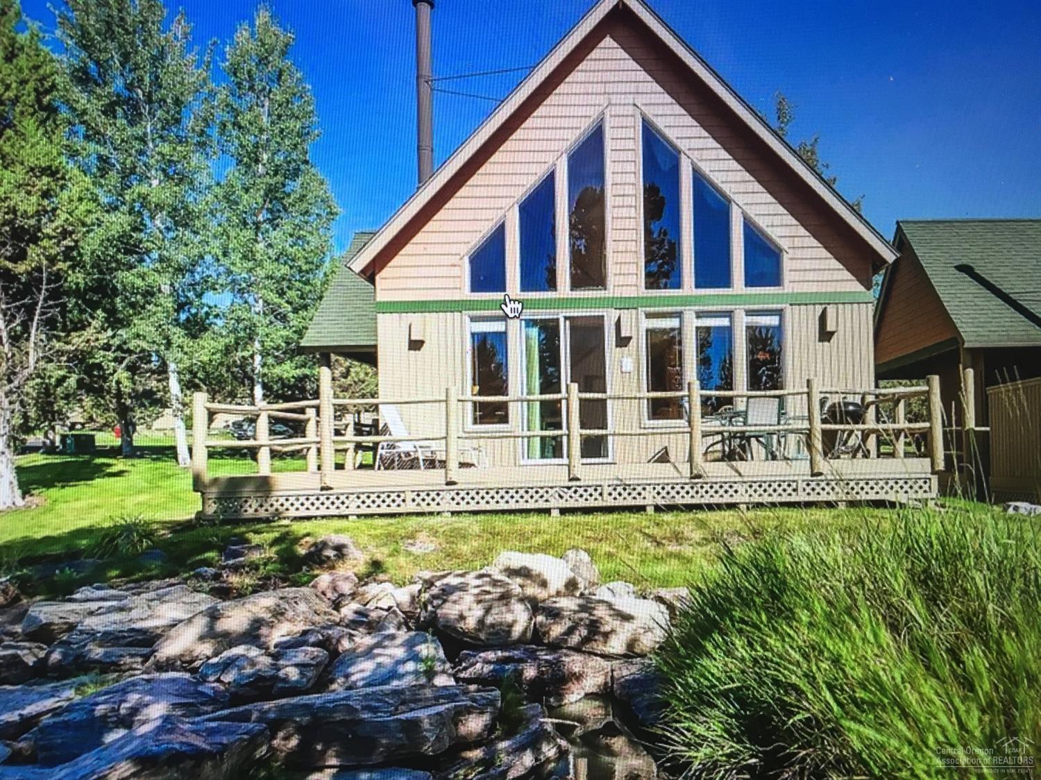 Beautiful Turn Key Chalet. 3 bed, 2 bath, Sunrise view from loft. New kitchen & downstairs bathroom floors. Huge corner lot. Water feature off back deck. Enjoy all the amenities that Eagle Crest has to offer, Golf, Pools, Sports center.
