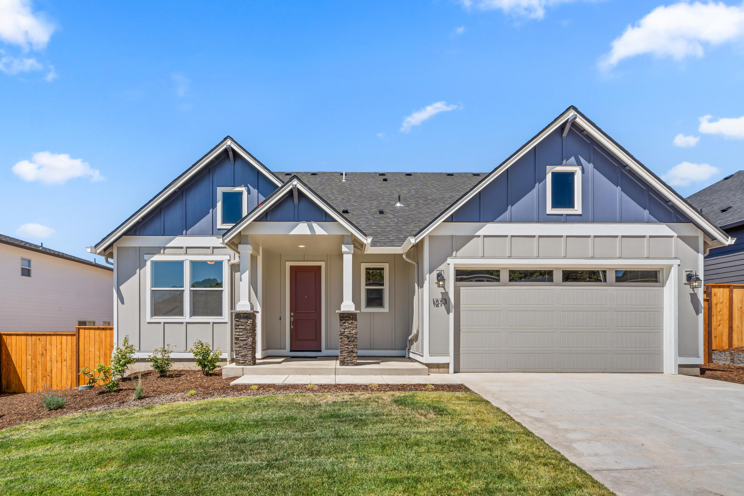 Come explore this new construction home in the desirable Eagle Point Golf Community. A brilliantly crafted primary on main level home, the 2096 plan boasts a large open main floor with two car garage plus shop, front of the house office and a vaulted great room. Laundry, double door den and open great room to kitchen with eating bar island round out the first floor, with laminate and carpet flooring throughout the main living spaces. A unique second floor layout with two bedrooms and a full bathroom will be appealing for varying lifestyles and family types, with both separation and togetherness. Floor plans are computer generated and actual construction may vary. Please check in with onsite agent. Home under construction, estimated completion date: February, 2026
