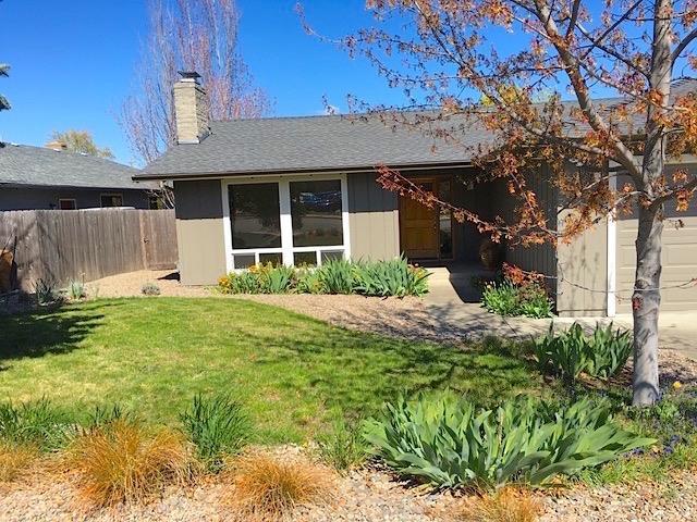 This well-built, single-level home is situated in a nice neighborhood in the coveted Helman school district. The owners have extensively remodeled the home over the years, including the kitchen and baths, making the home comfortable and efficient as well as attractive. The living room has a nice fireplace and expansive windows for maximum light, and the spacious, eat-in kitchen opens to a deck and mountain views. All kitchen appliances are included making this lovely home move-in ready! Plus a nice yard for outdoor enjoyment welcomes owners and guests.