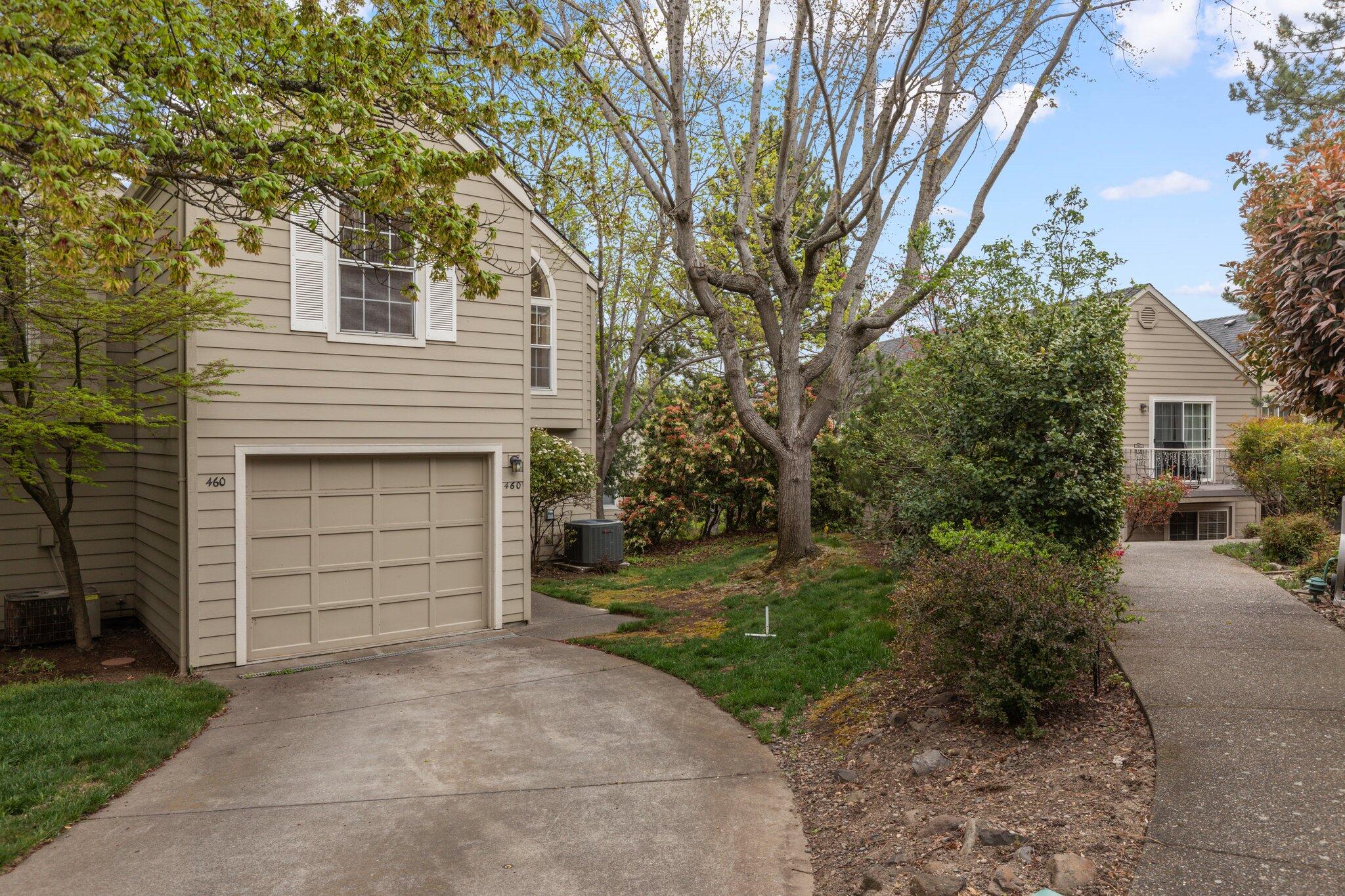Well maintained end unit with lots of windows for great lighting. The townhome is close to downtown Ashland Plaza. There's a full bedroom & bath on the main level. Dining area has deck access off the kitchen & the living room has soaring ceilings! Upstairs features a lovely primary bedroom with ensuite and windows for natural lighting along w/a 2nd bedroom. The grand open space has many uses, office, reading area or?? The HOA replaced the roof & siding in 2013/2014. Also covers landscape, pool, hot tub & club house. An on site manager is a great asset to have in this coveted complex!