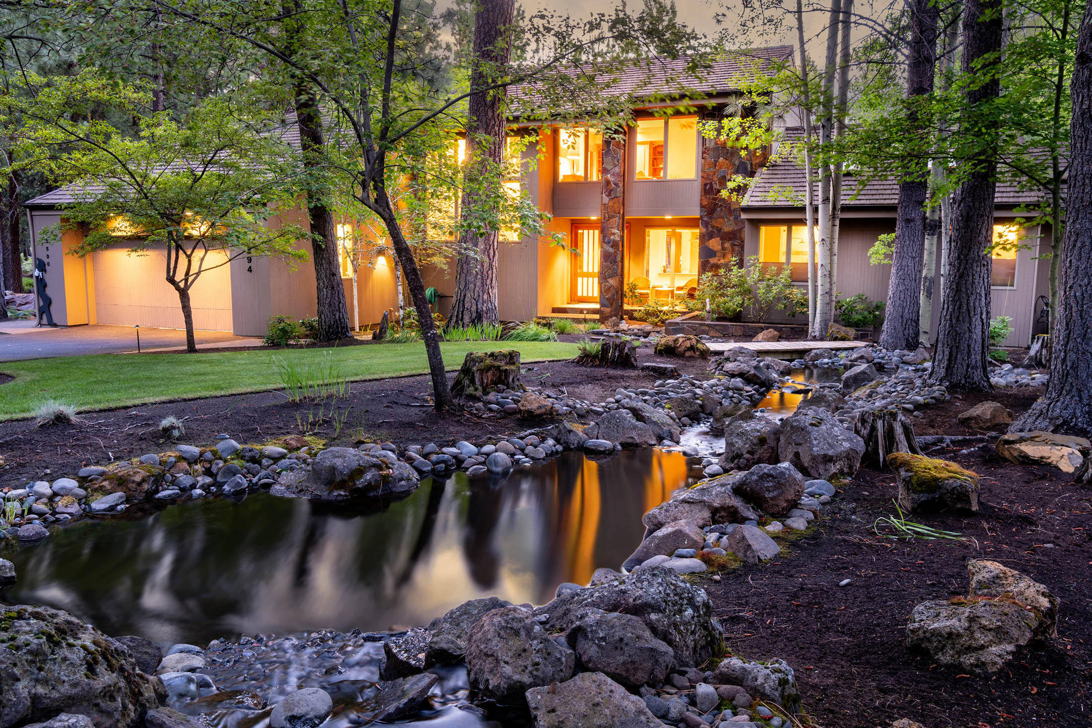 Timeless elegance and style are yours in this striking Black Butte home. An outstanding floor plan, top quality materials, and stunning use of windows, create a feeling of ''welcome home'' the minute you enter. You'll appreciate a relaxed, open floor plan featuring Montana Bronze slate fireplace, floor to ceiling windows in the great room, built-ins and French doors opening to the deck. A chef's kitchen boasts top-of-the-line appliances, walk-in pantry, and dine-in island. The main level master has it all; extensive windows, beautiful view, reading area, walk-in closet, and ensuite bath. Upstairs you'll find two bedrooms with ensuite bathrooms, reading/media space and large flex room with storage. Included in the total square feet of this home is a lower level with 700+ square feet for working out, media, storage, and full bath. Take pleasure in gracious outdoor living and entertaining with both an extensive deck and beautifully landscaped yard with stunning water feature.
