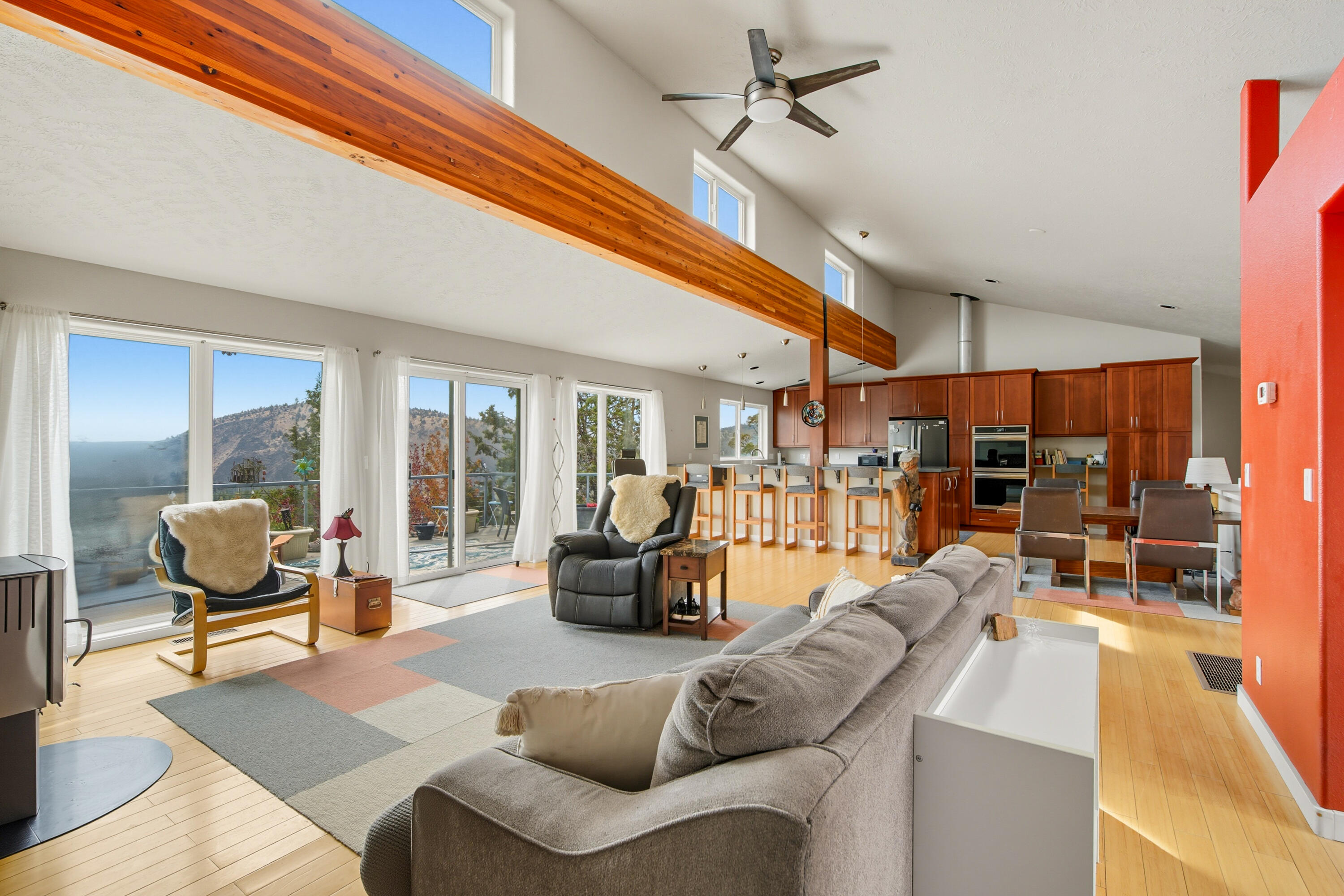 Stunning home with breathtaking views in a serene, private setting just minutes from the Deschutes River Canyon, Steelhead Falls, and public lands. A wall of windows fills the spacious great room and kitchen with natural light and showcases sweeping canyon and valley views. The primary suite is a tranquil retreat with a walk-in shower, soaking tub, and private access to the deck and yard. The finished walk-out basement offers a family room, bathroom, sleeping area, and kitchenette—perfect for guests, multigenerational living, or rec space. This home offers comfort, versatility, and direct access to Central Oregon's outdoor lifestyle. Schedule your tour today!
