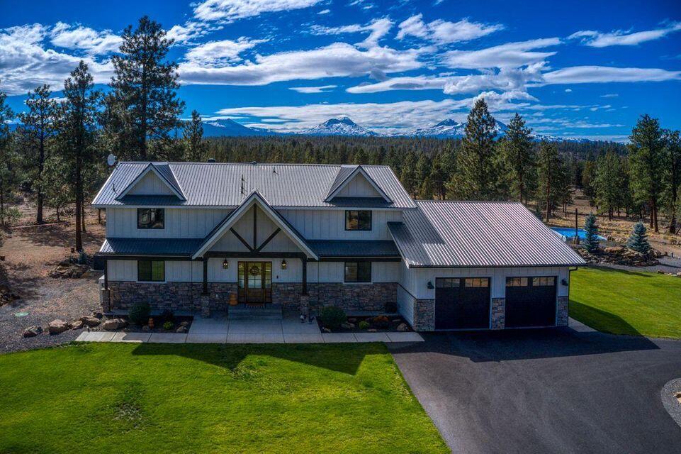 Mountain dream home on the market for the first time ever! Exudes mountain living with breathtaking views! Magnificent in form, function and design. Welcome to 67521 Trout Ln. Bend OR. Created on 10 fully fenced acres, the home offers over 3,300sf of living space, post and beam accented throughout, living room anchored by the floor-to-ceiling wood burning fireplace, a wall of windows perfectly framed view of the Three Sisters. Amazing kitchen to delight any chef! Fantastic flow for entertaining! Outside, you'll find most inviting spaces, with areas for dining, lounging, a fire pit, hot tub, swimming pool, level manicured lawn with asphalt driveway to completes the package. Come make this your private Mountain Retreat!