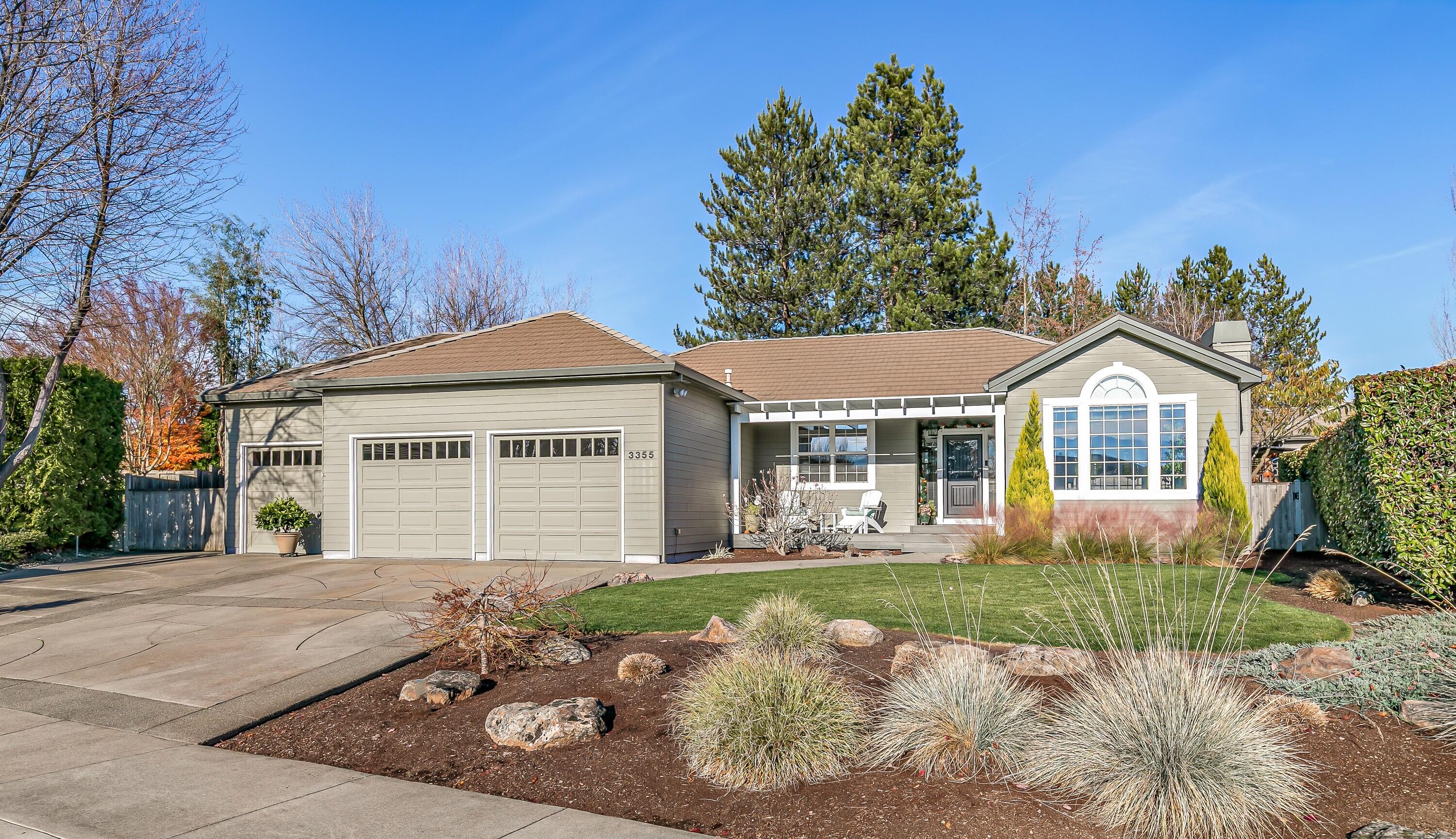 Beautifully maintained 3-bed, 2-bath Mahar home on a private .26-acre parcel on quiet cul-de-sac. Built in 1994 & detailed with wonderful comfort & style. Vaulted ceilings, abundant natural light, floor-to-ceiling windows, arched doorways, crown molding, & sleek wood-look tile floors. Gorgeous, updated kitchen with black-flecked granite, crisp white cabinets, gas cooktop, stainless hood, & 3-seat dining counter. Spacious contemporary living areas include living room with fireplace & loads of light. Great room with white bookcases and cabinets opens to the kitchen & dining room.  Primary suite has walk-in closet & double-sink granite vanity. Covered Trex deck, patios, gazebo with power, water features, manicured lawns, privacy hedges, & garden. The rear yard is fabulous! RV gate with parking. New HVAC (2024), newer water heater, Hardiplank siding, tiled roof, and 3-car garage with epoxy floors and cabinetry. CCRs only—no HOA. A quiet, immaculate neighborhood with lovely mountain views.