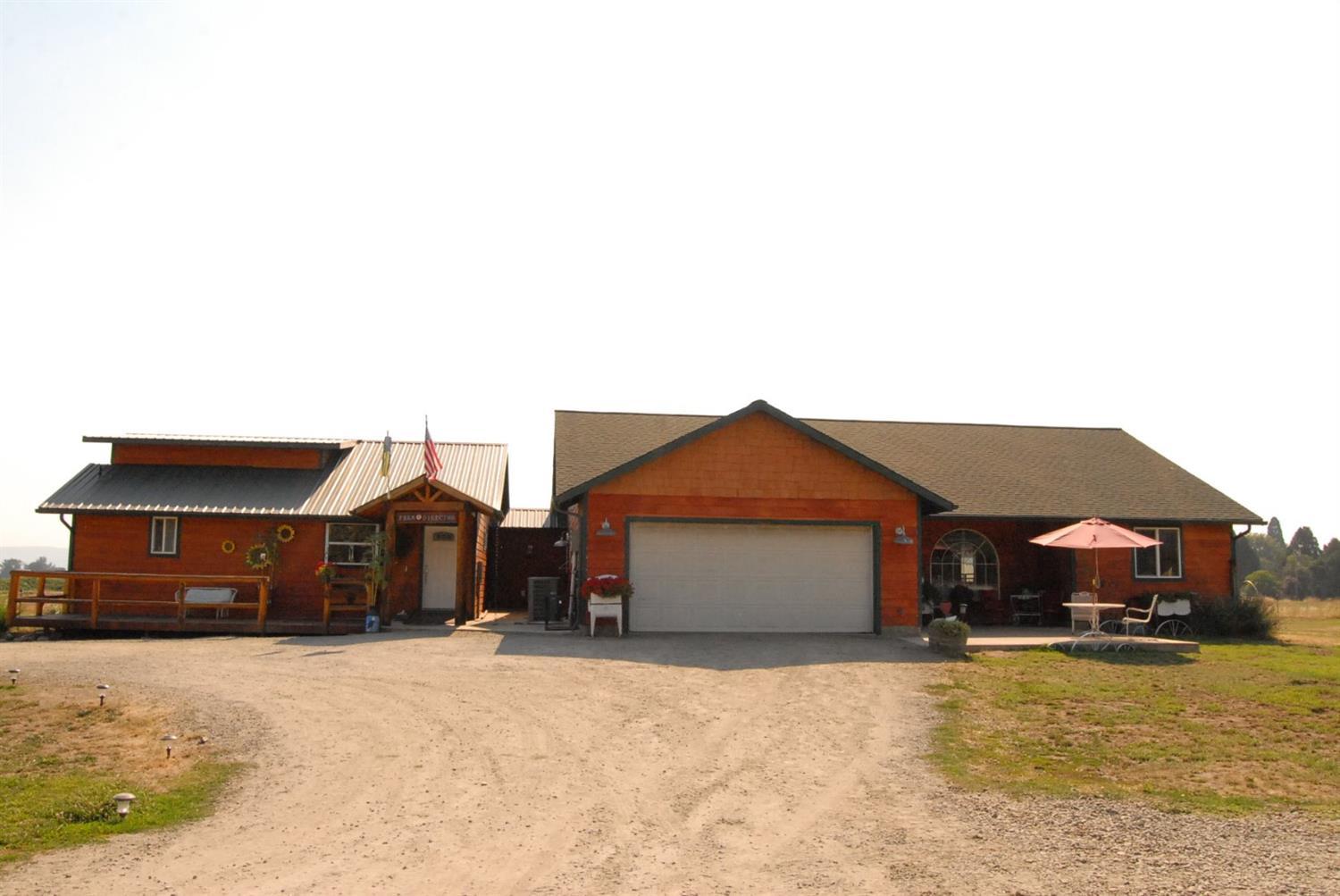 Two or three family set up with room to GROW and income potential! Over 25 acres, 2 tax lots zoned EFU with Water Rights, irrigation from well/pond! Class one soil (Per sellers) fenced & crossed fenced! Beautiful main 3 bdrms, 2 bath home w/ vaulted ceilings, large kitchen w/ granite countertops. Claw foot tub in master and walk-in jetted tub in main bath. Huge craft room. Large attached mother-in-law with full kitchen & 1 bath that could rent for $1,200 and a separate 1680sf 3 bed, 2 bath permitted manufactured home that could rent for $1,500. All with amazing views & privacy! Located 1 mile from Jacksonville & minutes to Medford. Barn & 280'x150' riding arena for training and/or boarding horses, irrigated pasture, tack room/hitching post, milking parlor, barn, four stalls, chicken mansion and several other outbuildings! RV parking. Fruit trees include plum, apple and more. Comes with some equipment valued at $25,000! (See attached list). Mature grape vines. Amazing property for a B&B