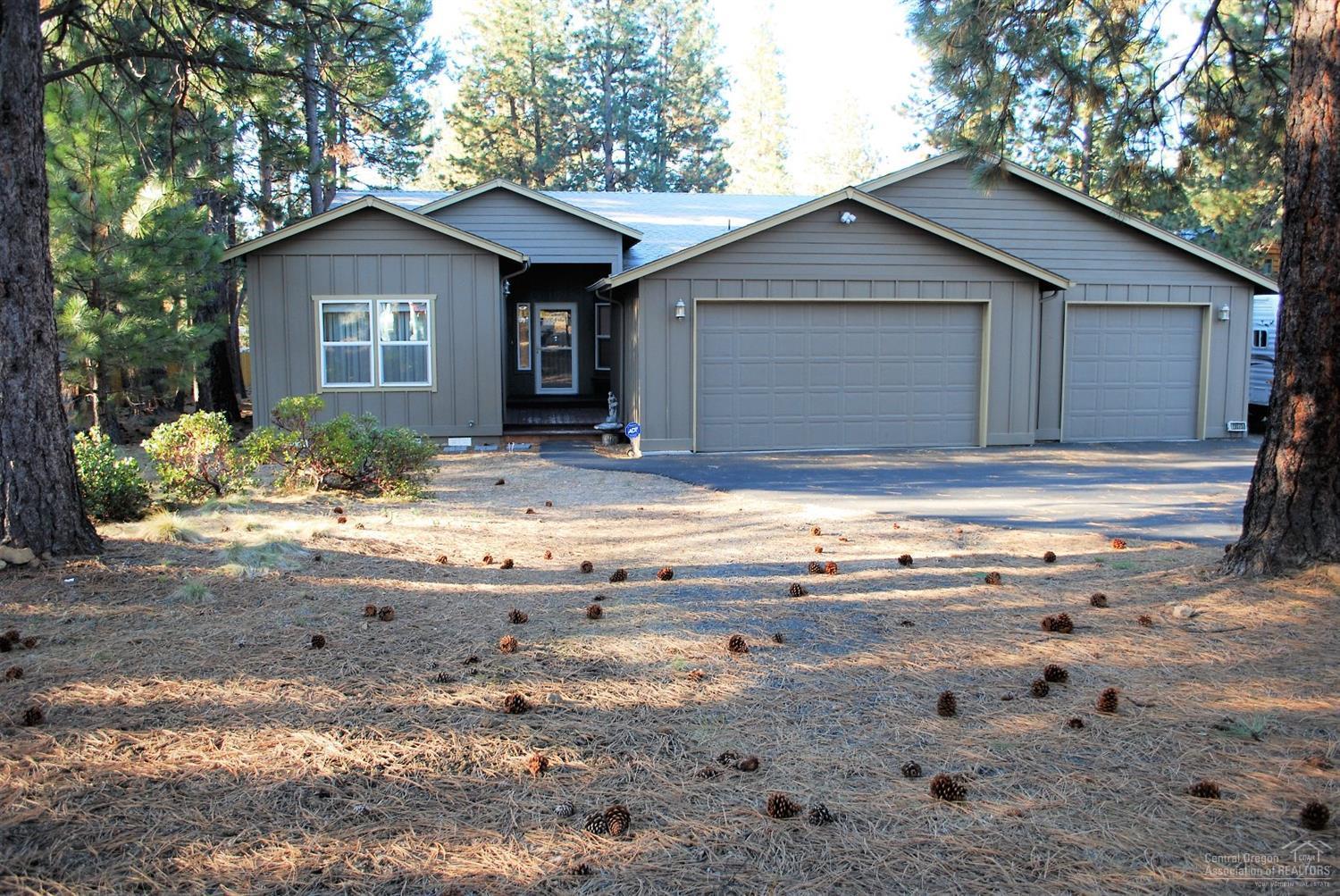 Your next home awaits! This beautiful custom home is move in ready. Recently remodeled kitchen with tile granite counters, newer cabinets and appliances, breakfast bar and dining area. Cozy great room with 10 ft ceilings and wood stove. The master features a sliding glass door to the back deck. The master bath includes a soaking tub, shower, double vanity and walk-in closet. AC and forced air. Wood wrapped windows. Custom up-down blinds. 3 car garage with 220 amp service. Asphalt driveway and RV parking.
