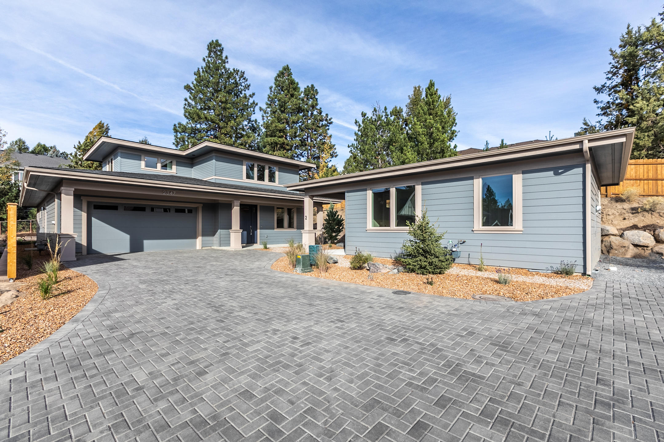 High quality new construction home with detached 1-level ADU situated at the end of a private drive, just 1/4 mile from the heart of downtown Bend!  Prairie style exterior with high quality interior finishes. Master and office on the main, 2 bedroom, bath and bonus area upstairs. Covered back patio with Large flat backyard (lot is just under 12,000 sqft).  Tankless hotwater heater, plumbed for Central Vac. Nice paver driveway to be installed extended from garage area and in front of ADU. Still time to pick finishes (subject to time and builder allowances).  Taxes are not assessed on final construction yet. Buyer to pay early issue title insurance. Bedroom & Bathroom total includes ADU.  Listing agent related to seller but has no ownership in building company.  NOTE: HOUSE living sqft is approx 2407 and ADU approx 600 for total of 3007 approx sqft living space.