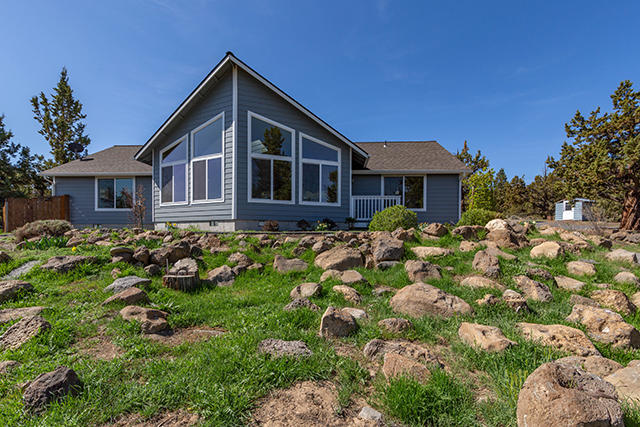 Immaculate single-level open concept 3B/2BA home sits high on this 2.5 acre lot offering NE views from Mt. Jefferson to the Ochocos.  Inside, you will find an expansive vaulted living room with hardwood floors, pellet stove, skylights, and full view windows.  The open kitchen features granite countertops with tile backsplash, island counter, stainless steel appliances, and a window over the sink overlooking the back patio.  Private master features a vaulted ceiling, master bath with separate shower & bathtub and large dual vanity sink.  The laundry room has lots of cabinet storage options.  Outside you will find plenty of outdoor space to relax with deck and patio, and room for all your tools and toys with an enormous 2,944 sq ft shop with 20'x40' RV bay.  Above the shop is a hobby room with its own ductless air.  A fenced side yard includes greenhouse and separate garden area.  There are also 2 storage sheds and a 12'x18' bunkhouse/shed on this beautifully landscaped property.