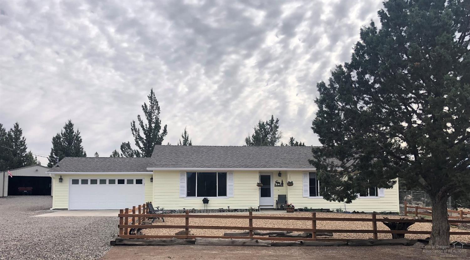 Wonderful single level home with shop on just under 5 acres! Recent updates include new exterior paint in 2017, laminate flooring, new SS appliances, quartz counter tops, refinished kitchen cabinets, & more! Two formal living room spaces, ceiling fans in every room, lots of windows & solar tubes for natural light. Fully fenced back yard includes new underground sprinkler system, raised bed gardens, mature trees w/ tree house & large deck for evening relaxation. Thoughtfully designed walking paths carved with lava rock around property, fenced & cross fenced for horses, 864 sq ft shop w/ 220 amp circular, circular drive. RV parking & full hookups. Peek-a-boo mountain views! Close to BLM, river, and town!