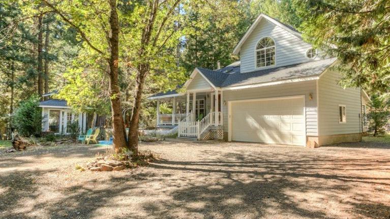 Wonderful Oregon Greensprings home on 5.93 acres! You will love this pristine forested setting located just about 1/2 hour from downtown Ashland. Set back off of the road for privacy & serenity, this Craftsman style home was beautifully built in 1993. The charming covered front porch expands into a wraparound deck for enjoying the outdoors & starry nights. The interior of the home has an open floor plan & many wonderful features that add to the overall charm & style: beautiful red oak floors; woodstove with tile surround & hearth; arched windows & doorways; vaulted ceiling; skylights; wall of windows overlooking the forest; wainscoting; crown molding; soaking tub; Travertine; glass paned doors & more. The setting is magical with the quiet forest, rock walls, large boulders, spa house, small workshop & tool shed. There are miles of trails for great hiking.
