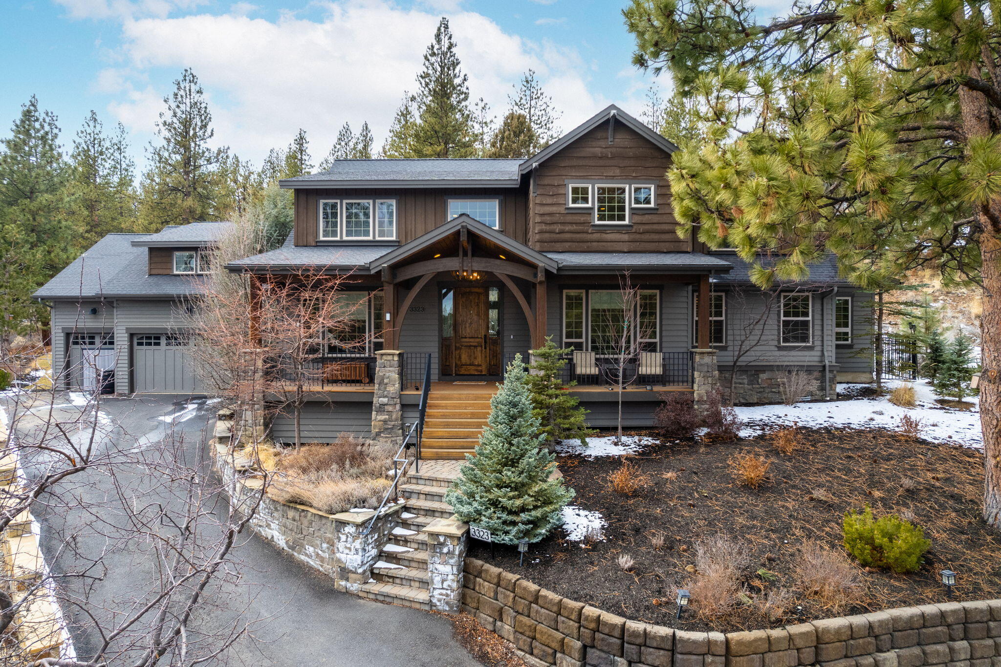 Awesome Bend location! This spacious 5-bedroom, 4.5-bath residence is perched atop a quiet cul-de-sac, offering both seclusion and breathtaking views of the surrounding scenery. Boasting 4,815 square feet of living space, there's ample room for every family member to find their own space for relaxation or entertainment. The open floor plan showcases a grand living room with high ceilings and expansive windows that flood the interior with natural light. The chef's kitchen, complete with a large island and abundant storage, is ideal for hosting guests. You'll find plenty of dining space with a formal dining room and a cozy breakfast nook. All five bedrooms are generously proportioned, and the primary suite, conveniently located on the main level, provides easy access to a private hot tub and adjacent den. This home offers numerous upgrades and exceptional quality, including brand-new, beautiful flooring. Don't miss the chance to explore this outstanding property!