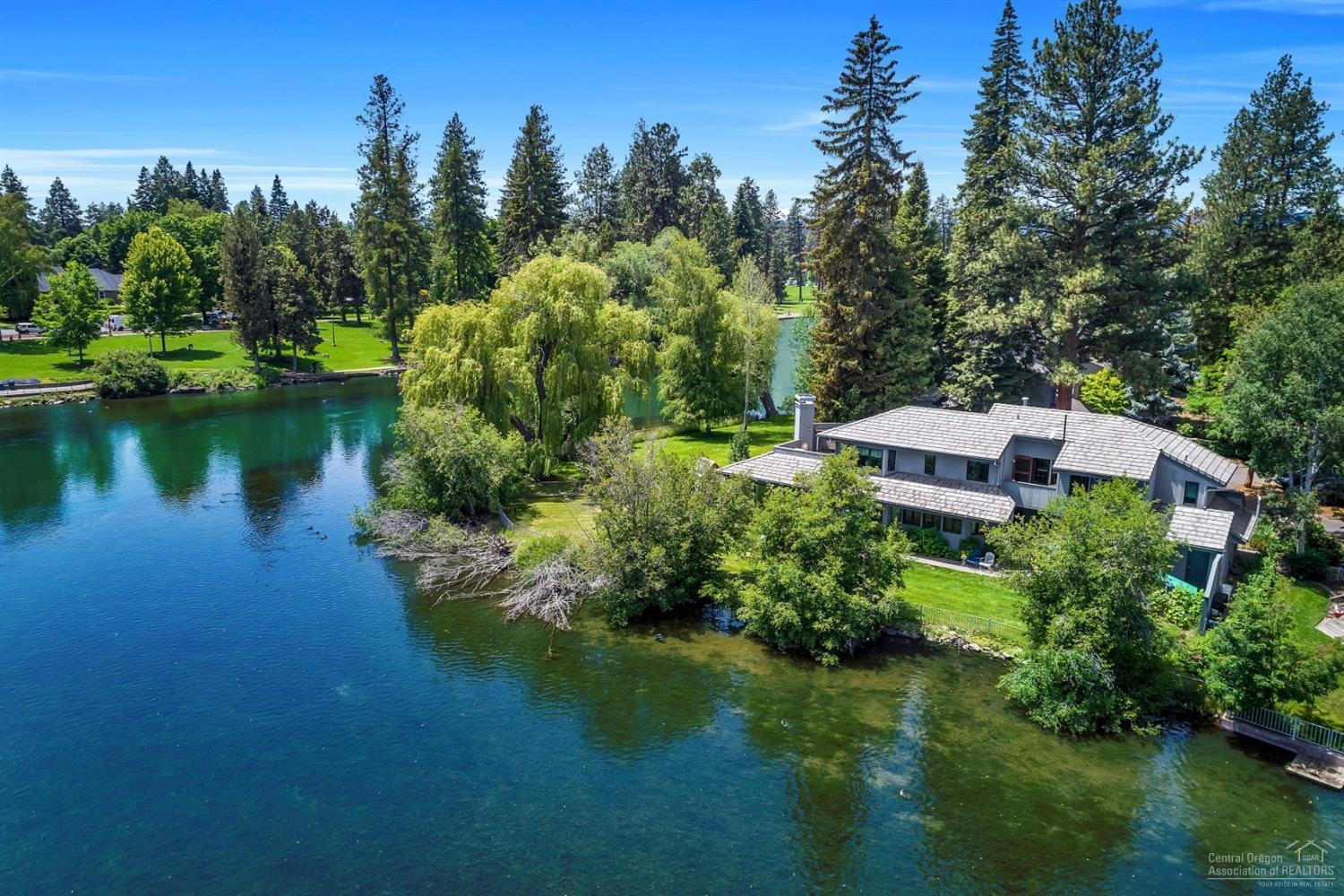 In the Heart of Downtown Bend yet tucked away on a quite cul-de-sac with 160 feet of Mirror Pond frontage you'll discover your very own Central Oregon paradise. This is that once in a lifetime find. Home offers commanding views of Deschutes River, Drake Park & Downtown. Stroll or bike to shops, pubs or your favorite restaurant. Paddle from your own backyard to the Old Mill District, Amphitheater or Columbia park. As of list date, home was Eligible for short term vacation rental through the city of Bend.