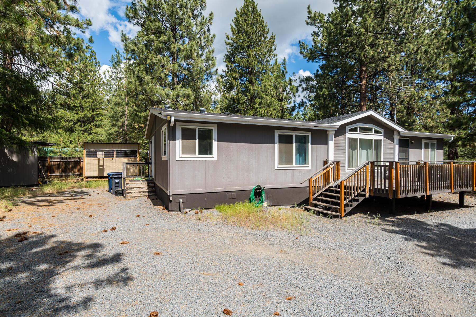 Ponderosa filled yard near the Deschutes River in the popular Deschutes River Woods neighborhood. Plenty of parking for your RV/boat/toys. Large deck spaces in front and back for outdoor living and enjoying the nearly .5 acre lot. Vaulted great room with floor to ceiling windows floods this home with natural light. Large storage shed and poultry coop for your extras. Home & property sold ''AS-IS''.