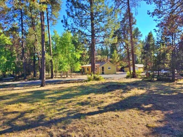 Move in ready Cabin on 1.14 Acres Zoned RSF inside the City limits of La Pine. Property was recently updated with new underground power service, City Water and Sewer installed. The property is zoned Residential (RSF) with potential to divide, check with City of La Pine regarding potential to partition for highest and best use. The property backs to public land with possibility to build on for an additional residence, rental or multigenerational living.  Once the seller starts the partition process this home will be offered on an approximately 1/3 acre lot.