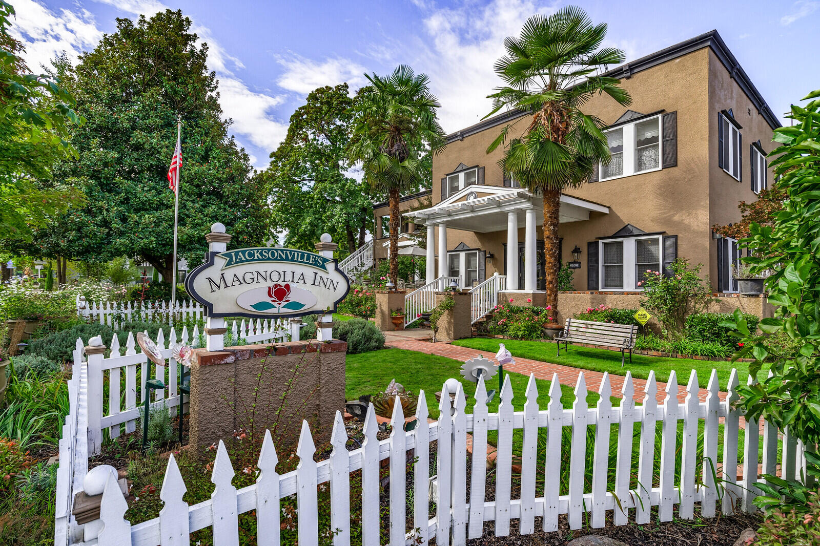 Rare opportunity to own one of the premier bed and breakfasts in Southern Oregon! Jacksonville's Magnolia Inn, built in 1928 and located in the heart of historic Jacksonville, boasts nine comfortably elegant rooms, each featuring premium linens, private bath, central air and views of lush gardens and historic buildings. This boutique hotel has been in operation for over 20 years, and is rated #1 in Jacksonville by Trip Advisor. Also included is the owners home - an attached 4-bedroom, 2.5-bathroom, kitchen, dining and living room, all of which is complemented by a private spa area, and expansive outdoor kitchen featuring a custom water feature, fire boulder and wisteria covered pergola. The boutique Inn has been completely renovated and provides a unique blend of casual elegance filled with charming hospitality. Just a block away from shopping, restaurants and all of Jacksonville's many amenities! Ready for new owners to continue the rich traditions of this timeless Inn!