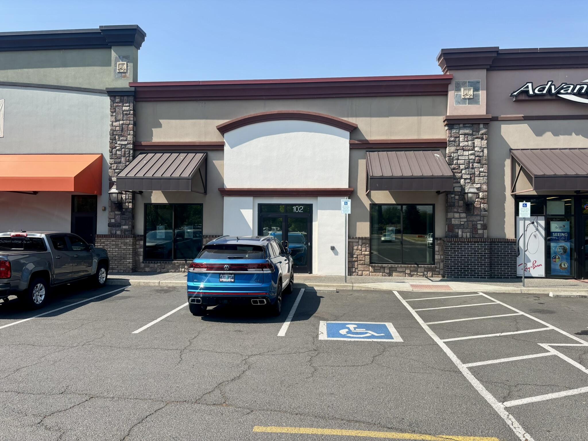 Located in the well-trafficked McAndrews Marketplace, this versatile commercial suite offers excellent exposure in one of Medford's busiest retail centers. The complex is home to a diverse mix of tenants, including restaurants, retail shops, a hair salon, physical therapy clinic, and military recruitment offices, drawing consistent foot traffic and visibility. The suite itself features a spacious open area with rubber flooring and four large skylights that provide abundant natural light. Inside, you'll find two private offices, two restrooms, a storage room with washer and dryer hookups, a break room, a patient waiting area, and a dedicated receptionist space. Previously used as a physical therapy office, the layout is ideal for medical, office, or retail uses. With ample on-site parking, convenient access to public transportation, and a central location in the heart of Medford, this is a prime opportunity to establish or expand your business in a thriving commercial hub.
