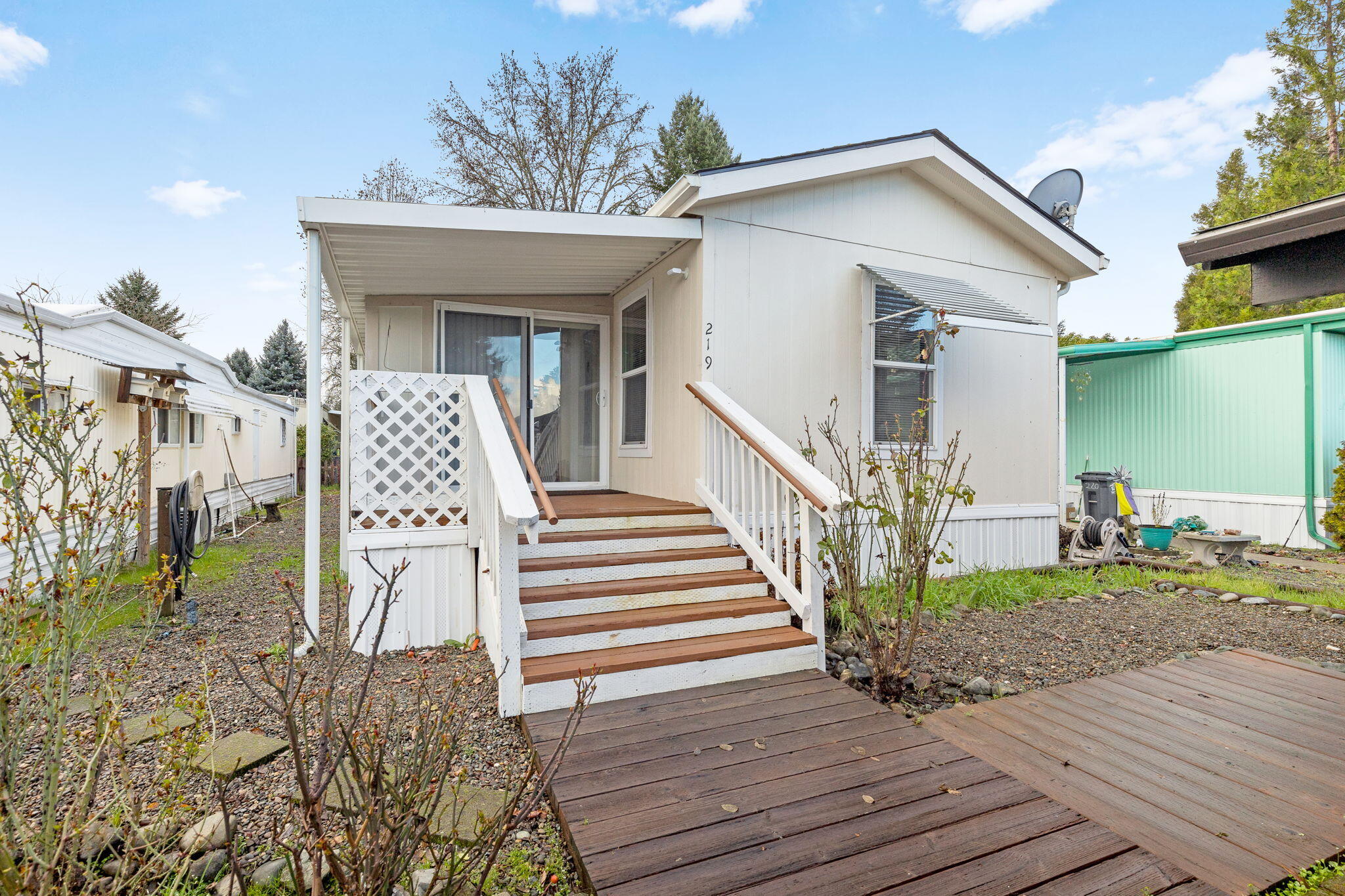 BRING ALL OFFERS! SELLER IS MOTIVATED! Come live in this ''like new,'' two bedroom, one bath updated home in Roguelea Estates. Grants Pass' premier 55+ manufactured home community sitting right along the mighty Rogue River. Living in this community you will have access to a private park along the river where you can watch the famous jet boat races, enjoy river wildlife, and have picnics with your friends and family. The beautiful lake offers trout and bass catch and release fishing. The Clubhouse offers a variety of activities and can be reserved for private parties. The home is updated with 798 SqFt and a bonus 300 SqFt completely enclosed patio for more living space, all new fixtures, new refrigerator, custom window coverings and kitchen island . All the work is done for you! Park does allow pets. Potential buyers must be approved by park management.