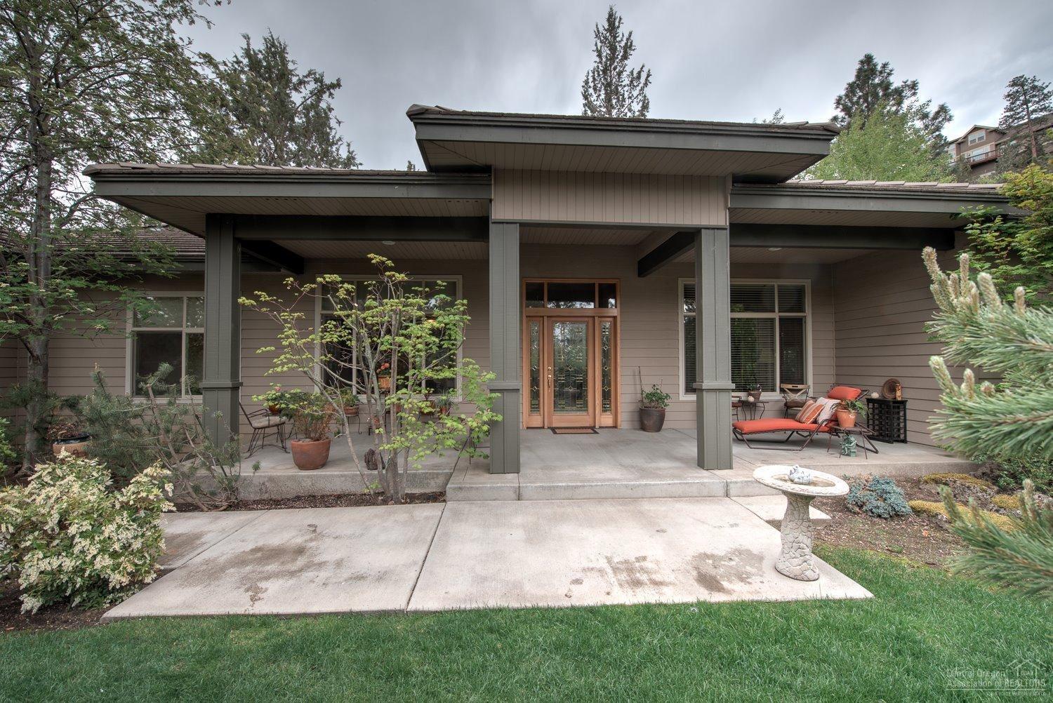 It is like living within a park adjoins Sawyer Park, NW Bend, single level 2500+/- sq./ft. 3 car attached garage on a half acre. Kitchen updated within last 4 years +/-, granite, new appliances, gas stove. Master has large fireplace & jetted soaking tub. Separate shower & water closet. Large great room, lots of light, lightly lived in. Large net stops golf balls and net is hidden by trees and large shrubs in part of the back yard, very private. Deschutes River just steps away. Easy access hwy 97.