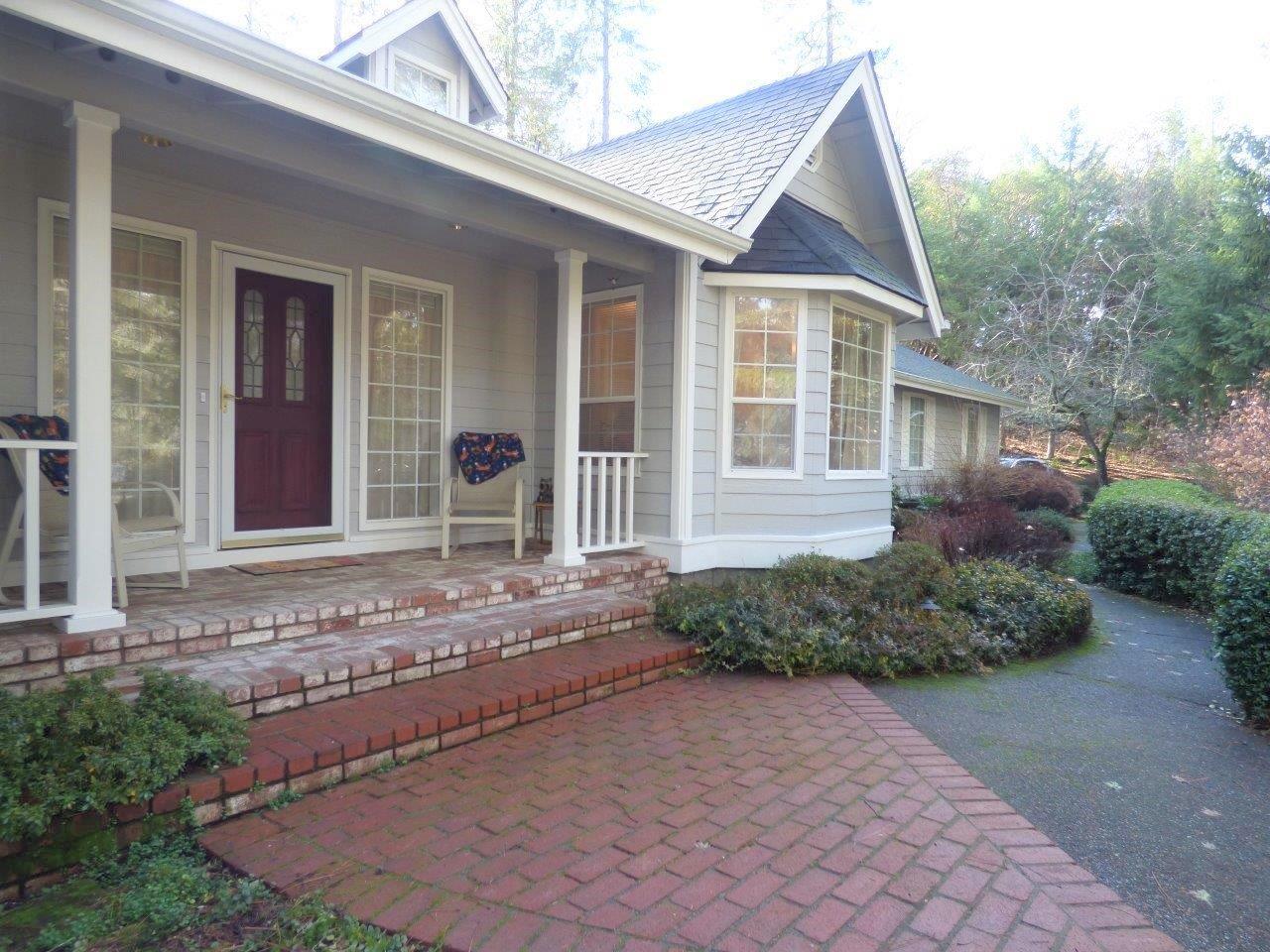 Amazingly Gorgeous well-maintained home on 1.7 acres less than a mile from Rogue River. Home has a split floorplan with the Master Bedroom separate from the other two bedrooms. Living room and family room (w/office built-in) have good separation. Formal dining area and breakfast nook--both with wonderful views. Generator is wired into panel in garage set up to run vital circuits in case of power outage. Loads and loads of storage space! Two detached double car+ sized garages, one set up for an RV with two roll-up doors, one as a workshop, both just steps from the home, as well as an attached, finished, 2-car garage. All have automatic openers. Home and garages freshly painted in August 2019. Wood, tile & Berber carpet floors. Travertine floors in kitchen & laundry. Water softener. Pond in backyard w/waterfall & goldfish. Asphalt driveway w/new LED lights in 2019. New roof in 2011. Well 30gpm when drilled, w/a new pump in June 2017. Two newer water heaters, one on each side of house.