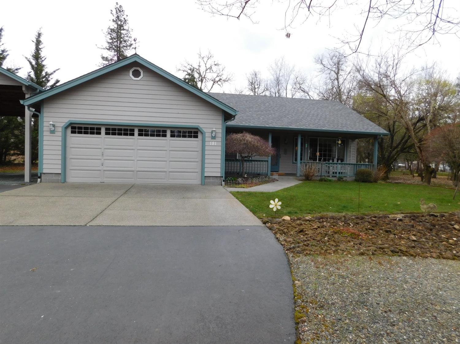 Welcome Home to this charmer. Covered front porch is a great spot to relax and enjoy nature. Featuring a 3 bedroom, 2 bath home with 1427 sf. Spacious kitchen with snack bar, an abundance of cabinets, slider to the deck and built-in writing desk. Great room with vaulted ceiling, bay window, and ceiling fan. Master suite with walk in closet, dual sinks and slider to the deck that is wired for hot tub. Attached two car garage, storage shed and paved driveway. Low maintenance 1 acre parcel, sprinklers and drip with mature landscaping. Covered RV parking. Close to town and schools. Low County taxes. Put this on your list to show.