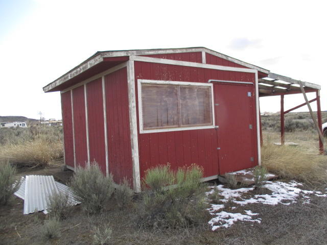 Great place to build a nice home or cabin.  Theres a nice storage building on the property too. This 2.43 +/- acre property  not far out of town so you don't have far to go to get supplies, groceries, gas and more. Water is at the back of the property for buyer to have connected. Enjoy the high desert and all the beauty there in.  The area is served by multiple restaurants, hardware store, grocery stores, gas station, gift shops, library, park, golf course, sports/tennis court, a clinic, EMT Services, credit union, and more. Great time to invest in the future for a great get away!
