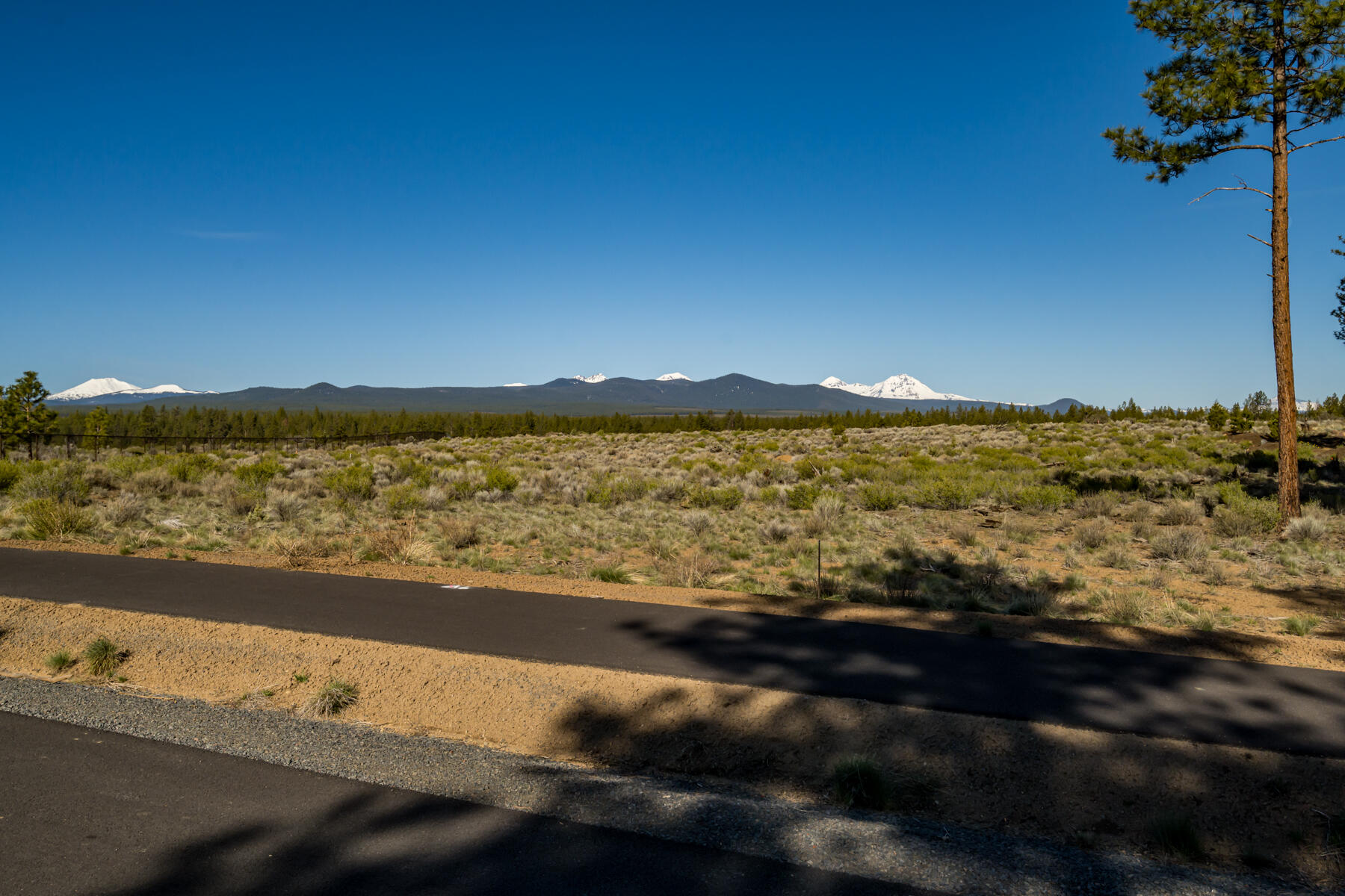 Perched above protected lands offering expansive vistas of the breathtaking mountain landscape, this remarkable 3.12 acre homesite is the premier lot in the highly sought after Westside neighborhood of Skyline Ranch. Bordering Shevlin Park and Tumalo Creek, the level topography and west facing orientation offer an unmatched canvas to build your architectural masterpiece showcasing sweeping unobstructed Cascade Mountain views that are forever preserved. With trail access out your door leading to endless adventures and Bend's most popular dining, shopping and amenities a short ride away, the location of this extraordinary property allows you to embrace an unrivaled blend of nature and urban convenience. Being offered for resale for the first time, don't miss this rare opportunity to own an awe-inspiring piece of land where you can enjoy the natural beauty of panoramic views of the Cascade Mountains from your own private refuge.