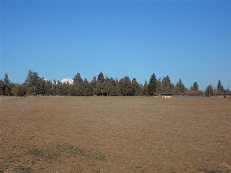 Buildable 5+ acre parcel located in the heart of Tumalo! Great potential views from the custom home you design. Perfect for a hobby farm, horses or simple living. Within 10 minutes of Trader Joes and all that the north end of Bend has to offer. The river trails are a hop across the street - follow the paths to enjoy your piece of Central Oregon!