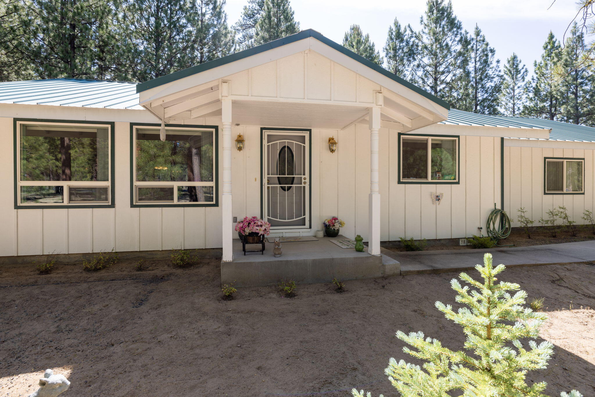 Charming 2 bedroom, 2 bath, 1,424 sq ft single-story home on 1.11 acres in a peaceful, active community that borders public land—perfect for hiking, riding, and outdoor recreation. Built in 2000, this well-maintained home offers an open floor plan with great flow, ideal for everyday living and entertaining. Enjoy a spacious covered back deck for relaxing or gathering with friends. The primary suite features a generous walk-in closet and is nicely separated from the second bedroom for added privacy. Outside, the property shines with a large 1,828 sq ft 4-bay shop complete with tall RV doors—ideal for storing vehicles, toys, or working on projects—plus a separate RV cover. Plenty of room for gardening, parking, or enjoying the Central Oregon lifestyle. Whether you're looking for a quiet retreat or a space to pursue your hobbies, this property delivers both comfort and functionality in a serene natural setting. A unique opportunity in a sought-after location!